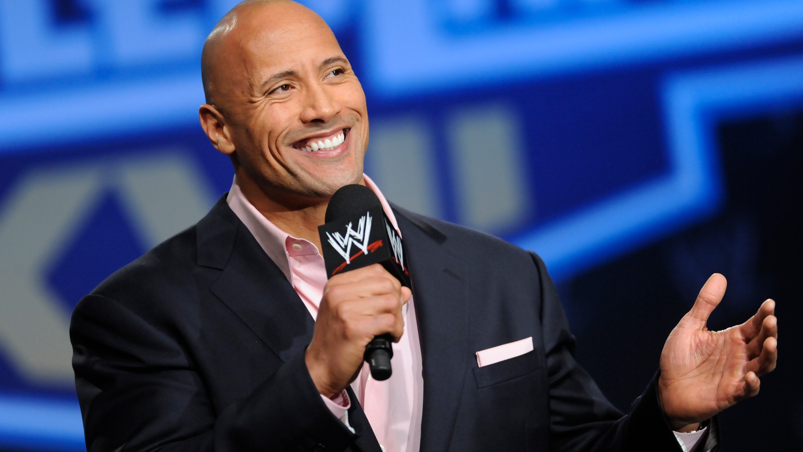 FILE - Actor and former WWE Superstar Dwayne "The Rock" Johnson participates in a Wrestlemania XXVII press conference at the Hard Rock Cafe in Times Square on Wednesday, Mar. 30, 2011 in New York. It is a name that has become almost synonymous with professional wrestling but its bearer, Dwayne Johnson, has never legally owned “The Rock.” That will change under a new agreement with the WWE under whichJohnson will also join the board of TKO Group, the sports and entertainment company that houses WWE and UFC.(AP Photo/Evan Agostini, file)