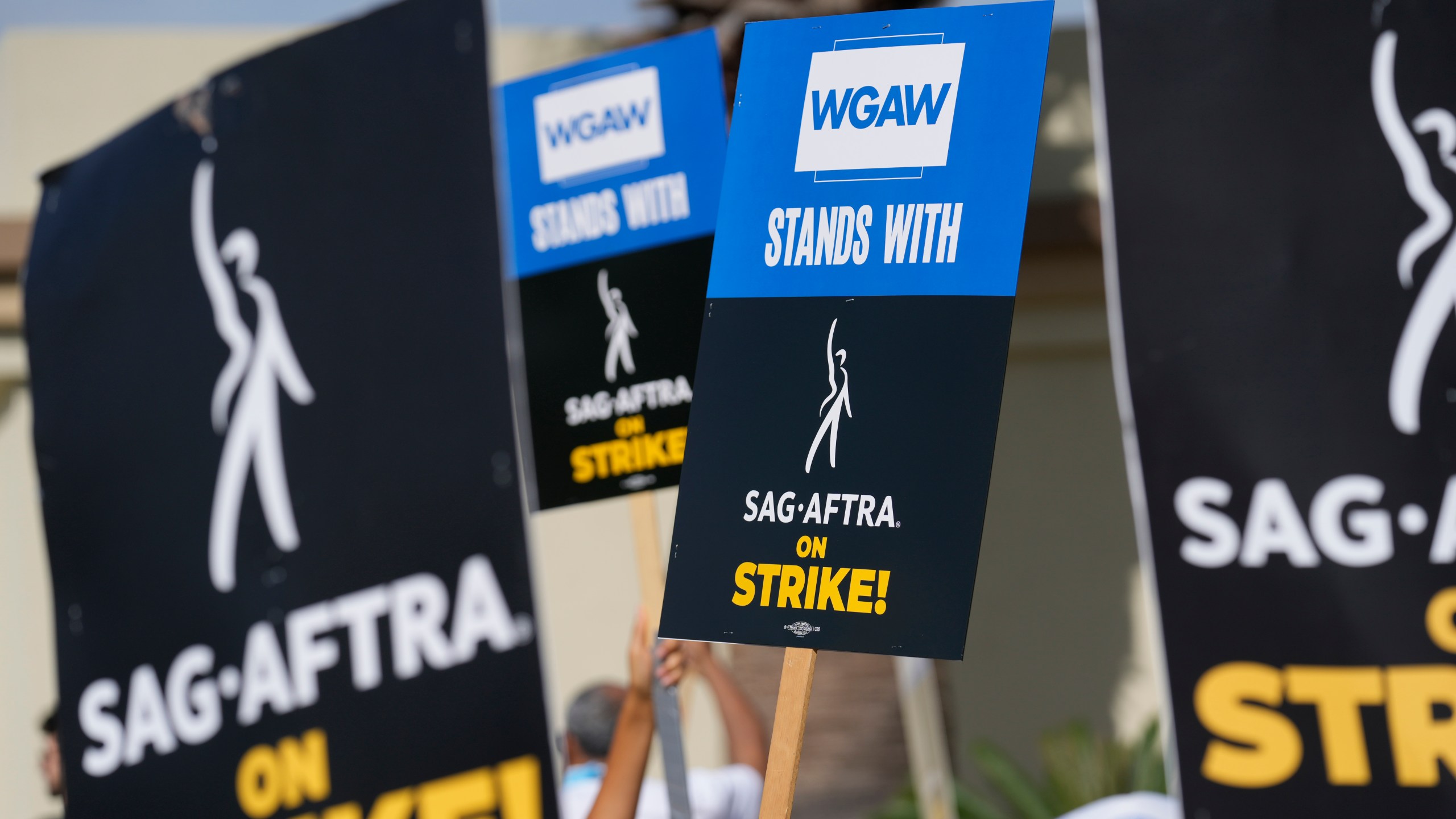 FILE - Picketers demonstrate outside Paramount Pictures studio on Wednesday, Sept. 27, 2023, in Los Angeles. Unions commanded big headlines last year, but that didn’t translate into higher membership numbers, according to government data released Tuesday, Jan. 23, 2024. (AP Photo/Chris Pizzello, File)