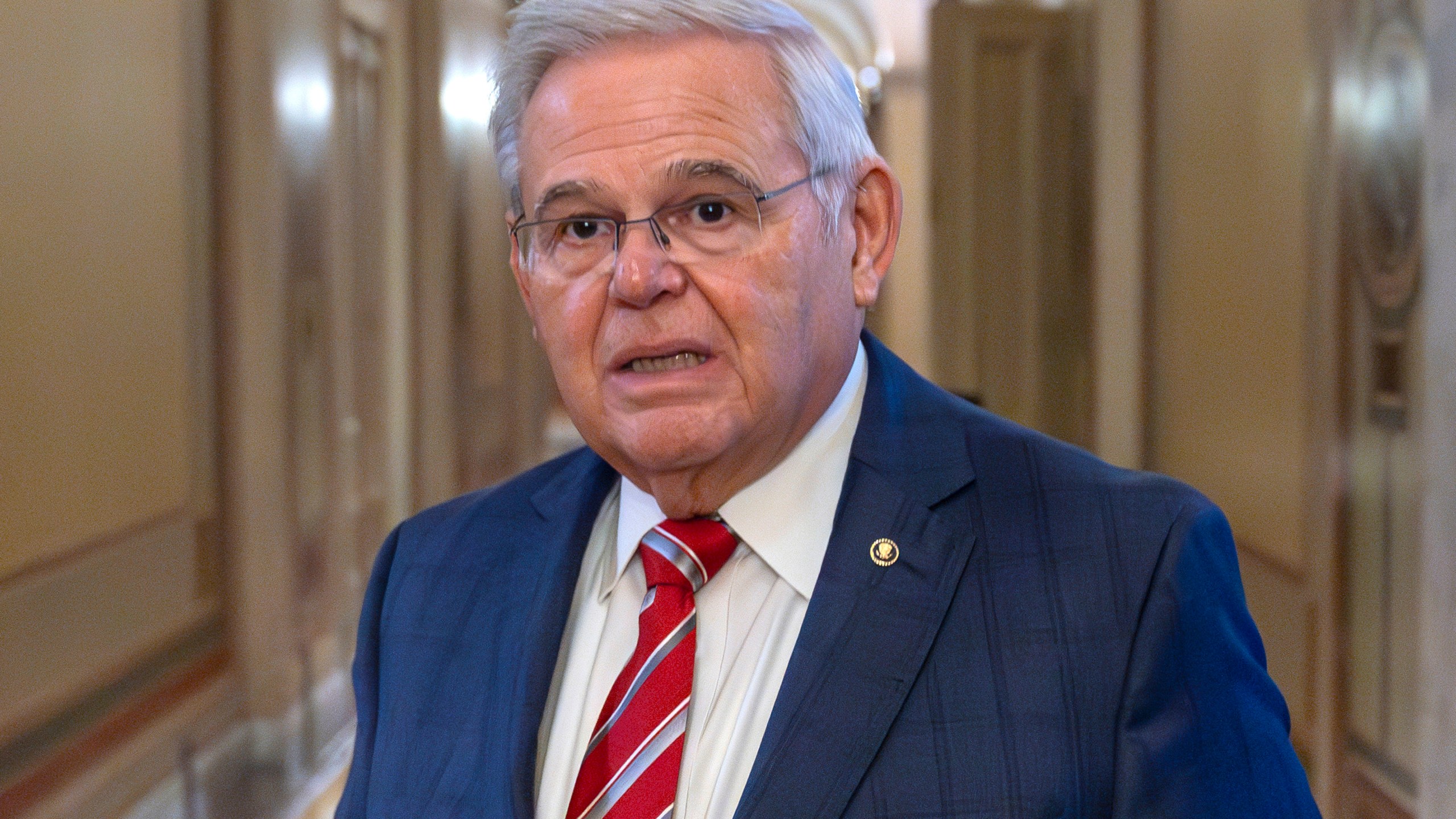 FILE - Sen. Bob Menendez, D-N.J., departs the Senate floor in the Capitol, Sept. 28, 2023, in Washington. Menendez introduced a member of the Qatari royal family and principal in a company with ties to the government of Qatar to a New Jersey businessman before the company invested millions of dollars in the businessman's real estate project, a rewritten indictment alleged Tuesday, Jan. 2, 2024. (AP Photo/Alex Brandon, File)