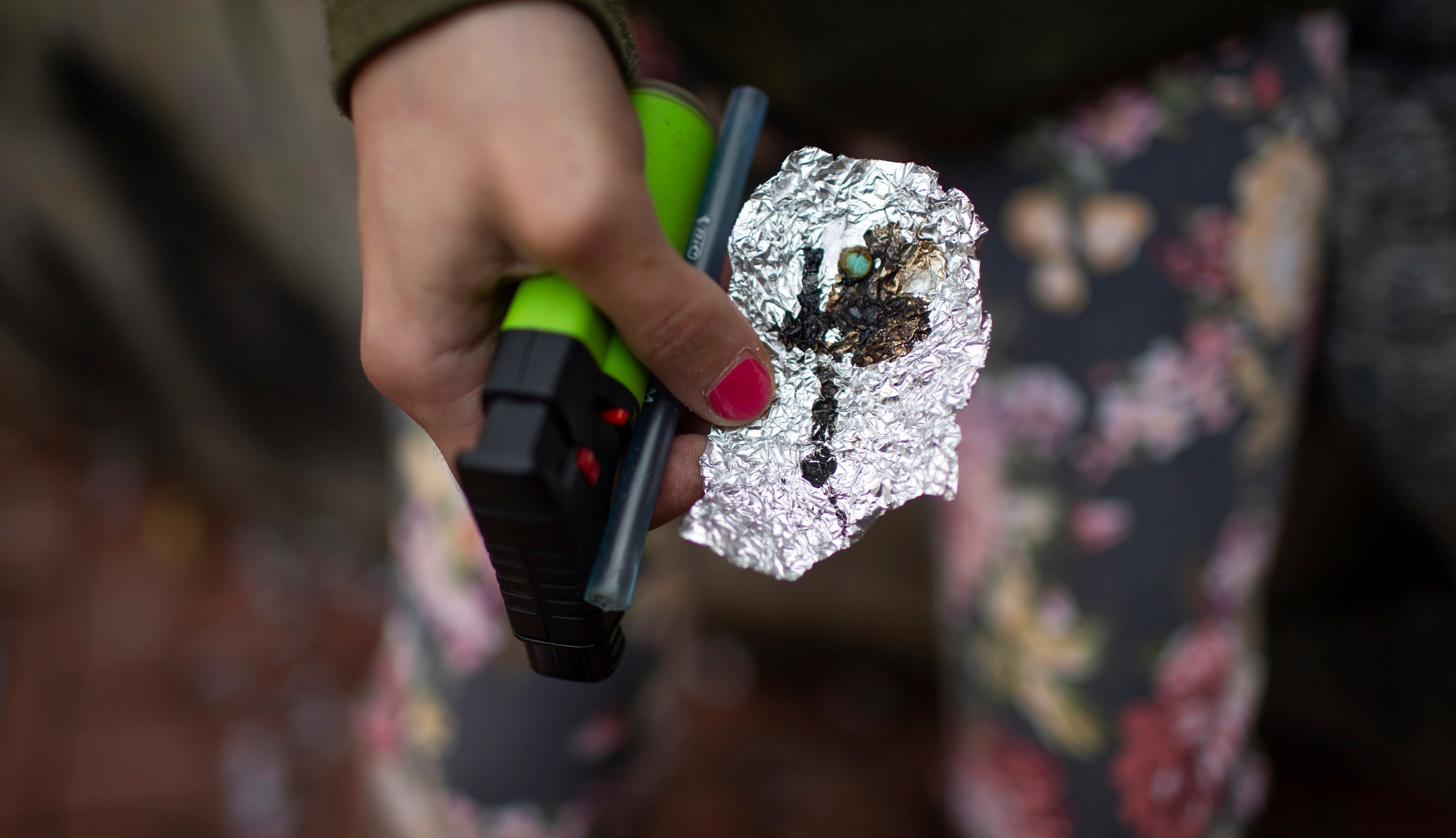 FILE - A person holds drug paraphernalia near the Washington Center building on SW Washington Street, April 4, 2023, in downtown Portland, Ore. On Tuesday, Jan. 23, 2024, Democratic lawmakers in Oregon unveiled a sweeping new bill that would undo a key part of the state's first-in-the-nation drug decriminalization law. The bill would recriminalize the possession of small amounts of drugs as a low-level misdemeanor. (Dave Killen/The Oregonian via AP, File)