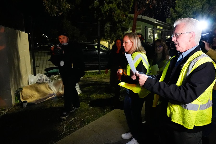 Los Angeles City Council President Paul Krekorian, right, joined by Supervisor Kathryn Barger, center, who represents the 5th supervisorial district of Los Angeles County, walks on the streets at the start of the annual homeless count in the North Hollywood section of Los Angeles Tuesday, Jan. 23, 2024. (AP Photo/Richard Vogel)