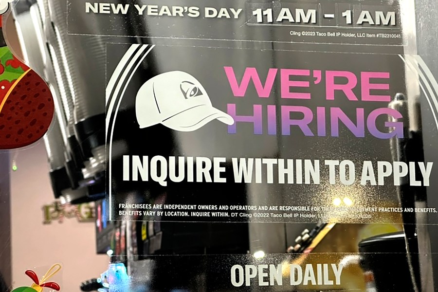 A hiring sign is displayed at a restaurant in Glenview, Ill., Tuesday, Dec.12, 2023. On Thursday, the Labor Department reports on the number of people who applied for unemployment benefits last week. (AP Photo/Nam Y. Huh)