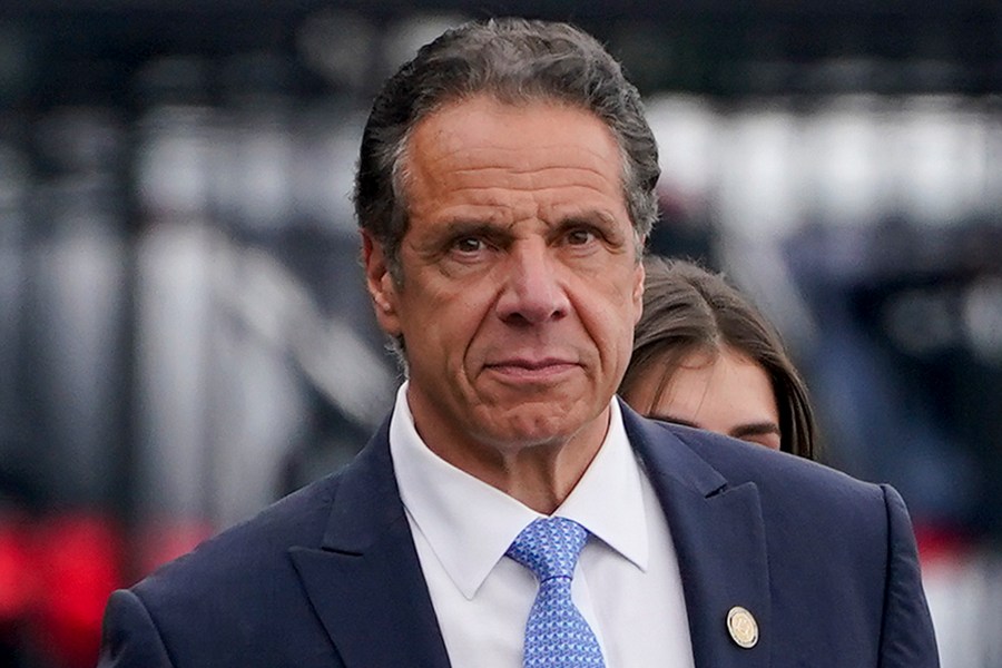 FILE - New York Gov. Andrew Cuomo prepares to board a helicopter after announcing his resignation, Aug. 10, 2021, in New York. On Friday, Jan. 26, 2024, the U.S. Justice Department reached a settlement with the state of New York to resolve a sexual harassment investigation of former Gov. Cuomo, confirming allegations from the damaging misconduct probe that led to the Democrat's resignation. (AP Photo/Seth Wenig, File)