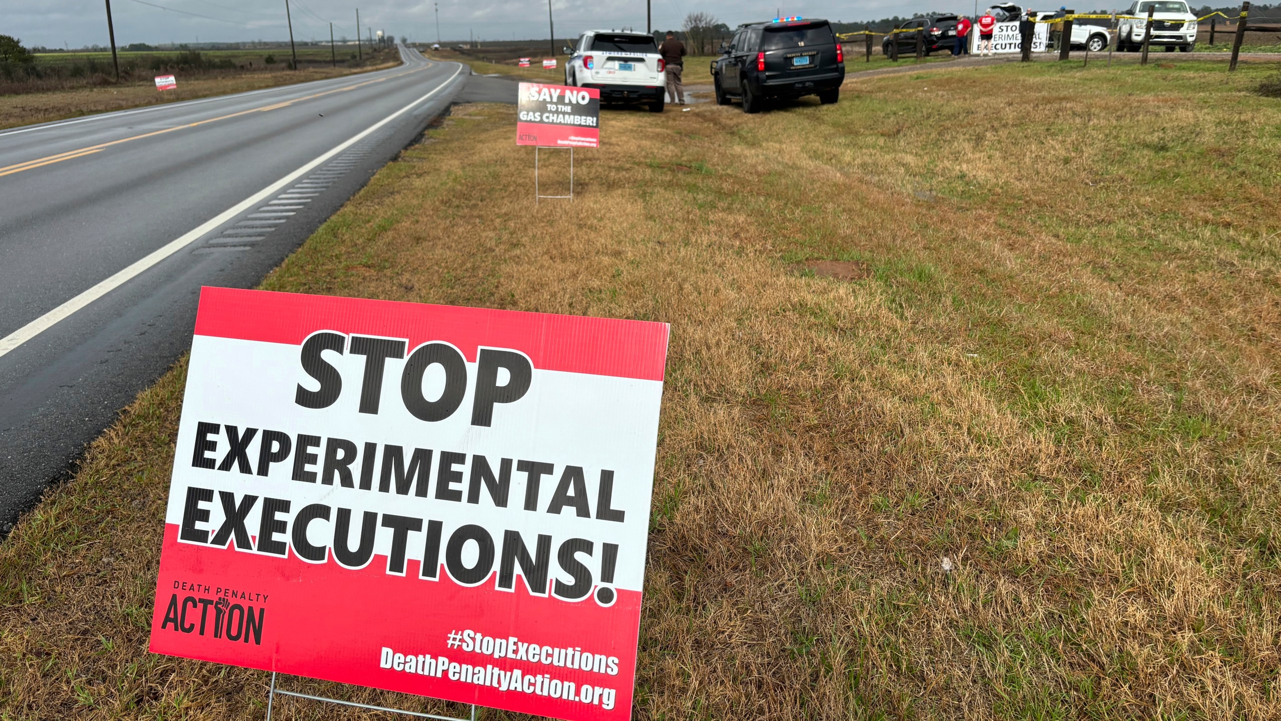 FILE - Anti-death penalty signs placed by activists stand along the road heading to Holman Correctional Facility in Atmore, Ala., ahead of the scheduled execution of Kenneth Eugene Smith, Thursday, Jan. 25, 2024. On Thursday, Alabama put Smith to death with nitrogen gas. (AP Photo/Kim Chandler, File)