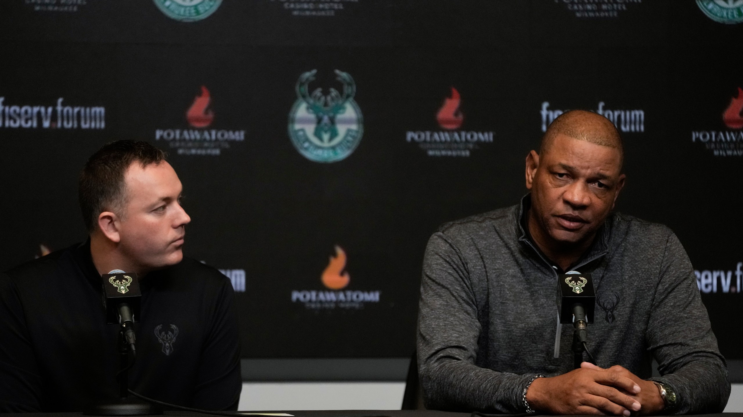 Milwaukee Bucks general manager Jon Horst listens as Doc Rivers speaks after being introduced as the Milwaukee Bucks head coach at a news conference Saturday, Jan. 27, 2024, in Milwaukee. (AP Photo/Morry Gash)