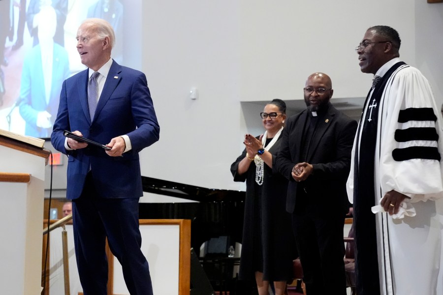 Reverend Dr. Jamey O. Graham Sr., right, looks on as President Joe Biden speaks at St. John Baptist Church in Columbia, S.C., on Sunday, Jan. 28, 2024. (AP Photo/Jacquelyn Martin)