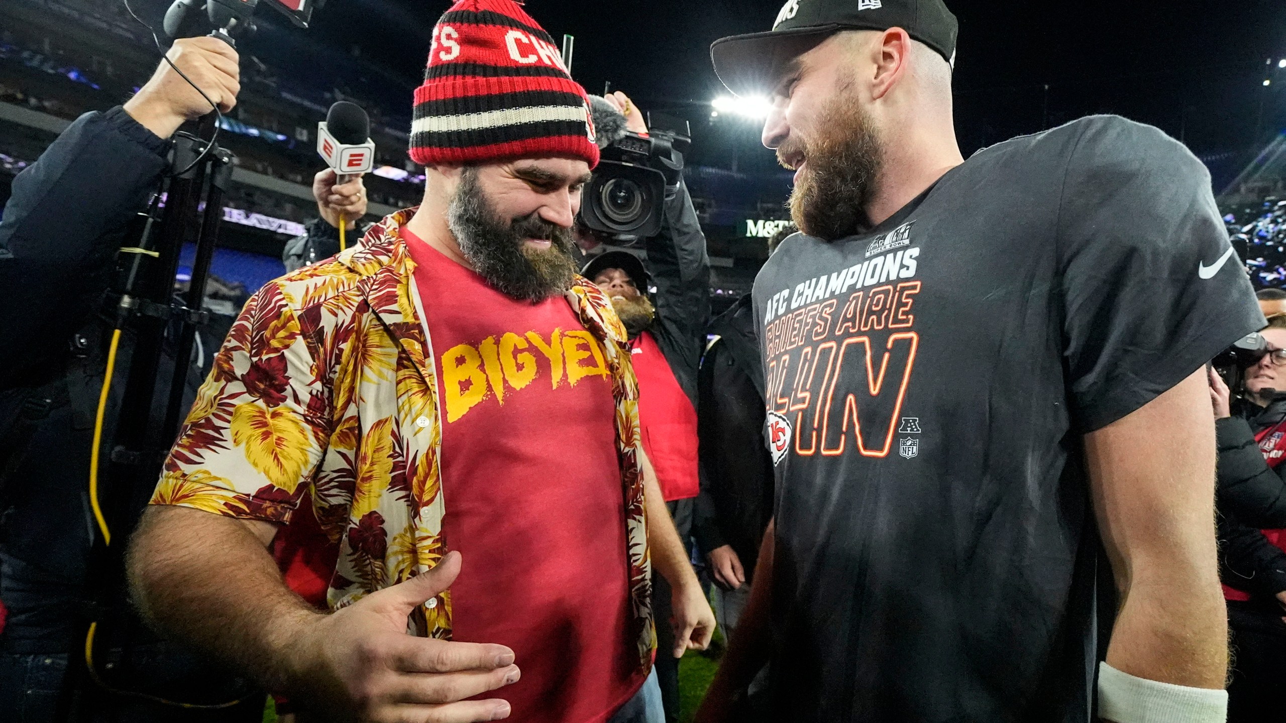 NFL player Jason Kelce, left, speaks with his brother Kansas City Chiefs tight end Travis Kelce after an AFC Championship NFL football game against the Baltimore Ravens, Sunday, Jan. 28, 2024, in Baltimore. The Kansas City Chiefs won 17-10. (AP Photo/Julio Cortez)