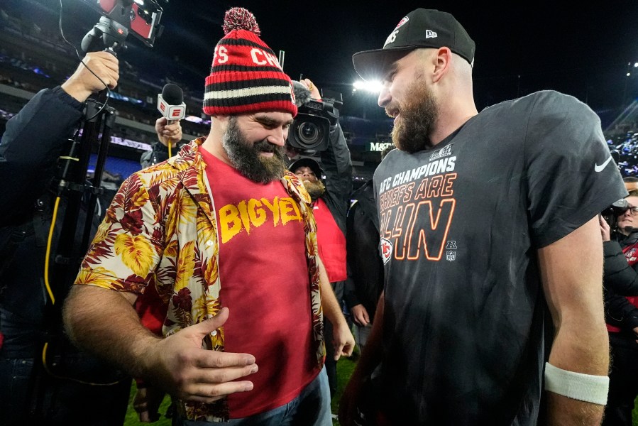 NFL player Jason Kelce, left, speaks with his brother Kansas City Chiefs tight end Travis Kelce after an AFC Championship NFL football game against the Baltimore Ravens, Sunday, Jan. 28, 2024, in Baltimore. The Kansas City Chiefs won 17-10. (AP Photo/Julio Cortez)