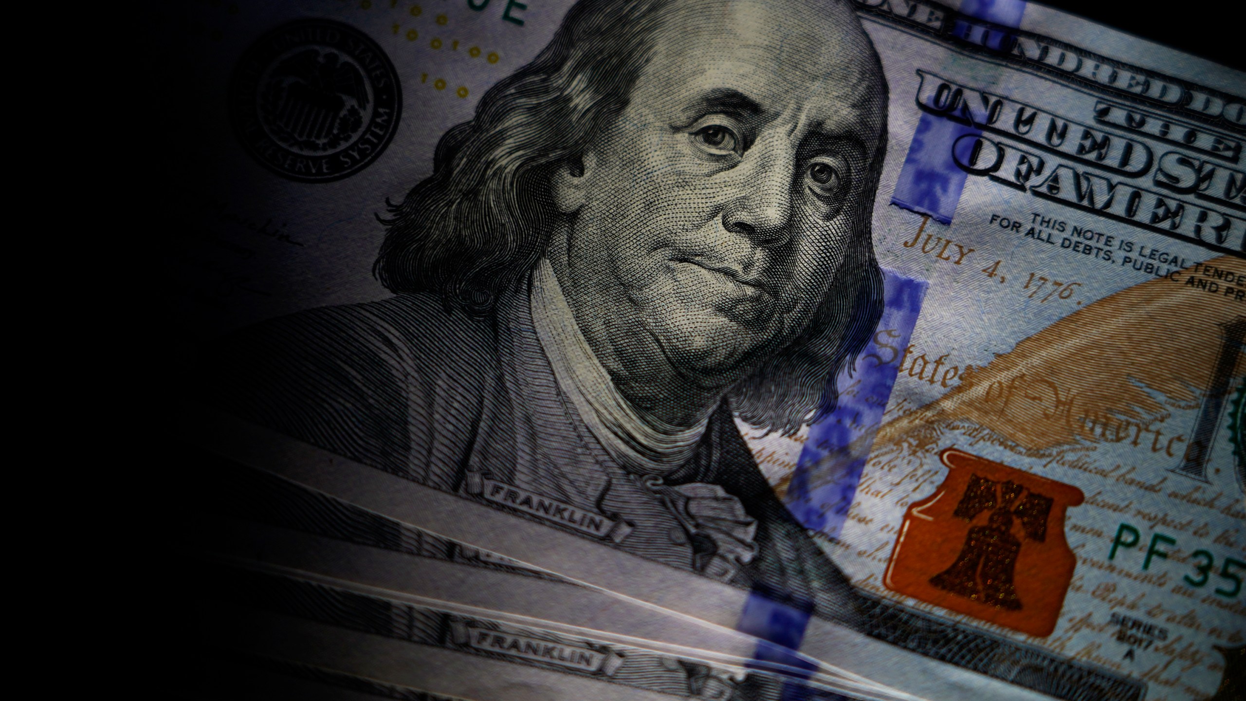 FILE - likeness of Benjamin Franklin is seen on U.S. $100 bills, Thursday, July 14, 2022, in Marple Township, Pa. Payroll payments per small business moderated as 2023 came to a close, according to new data from Bank of America. The BofA report found payroll payments rose 1.7% in December at small businesses. (AP Photo/Matt Slocum, File)