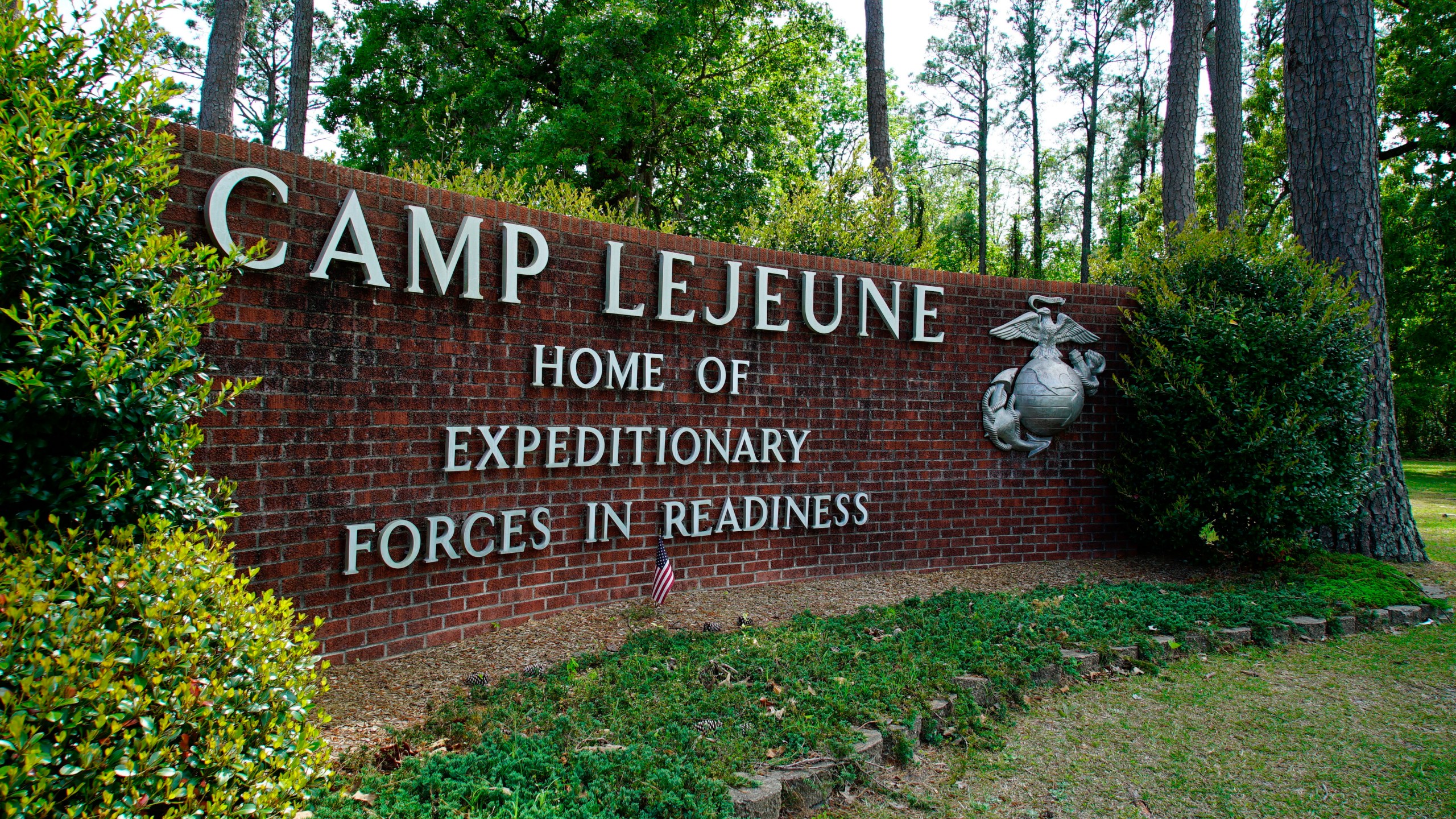 FILE - Signage stands on the main gate to Camp Lejeune Marine Base outside Jacksonville, N.C., April 29, 2022. Military personnel stationed at Camp Lejeune from 1975 to 1985 had at least a 20% higher risk for a number of cancers than those stationed elsewhere, federal health officials said Wednesday, Jan. 31, 2024 in a long-awaited study of the North Carolina base's contaminated drinking water. (AP Photo/Allen G. Breed, File)