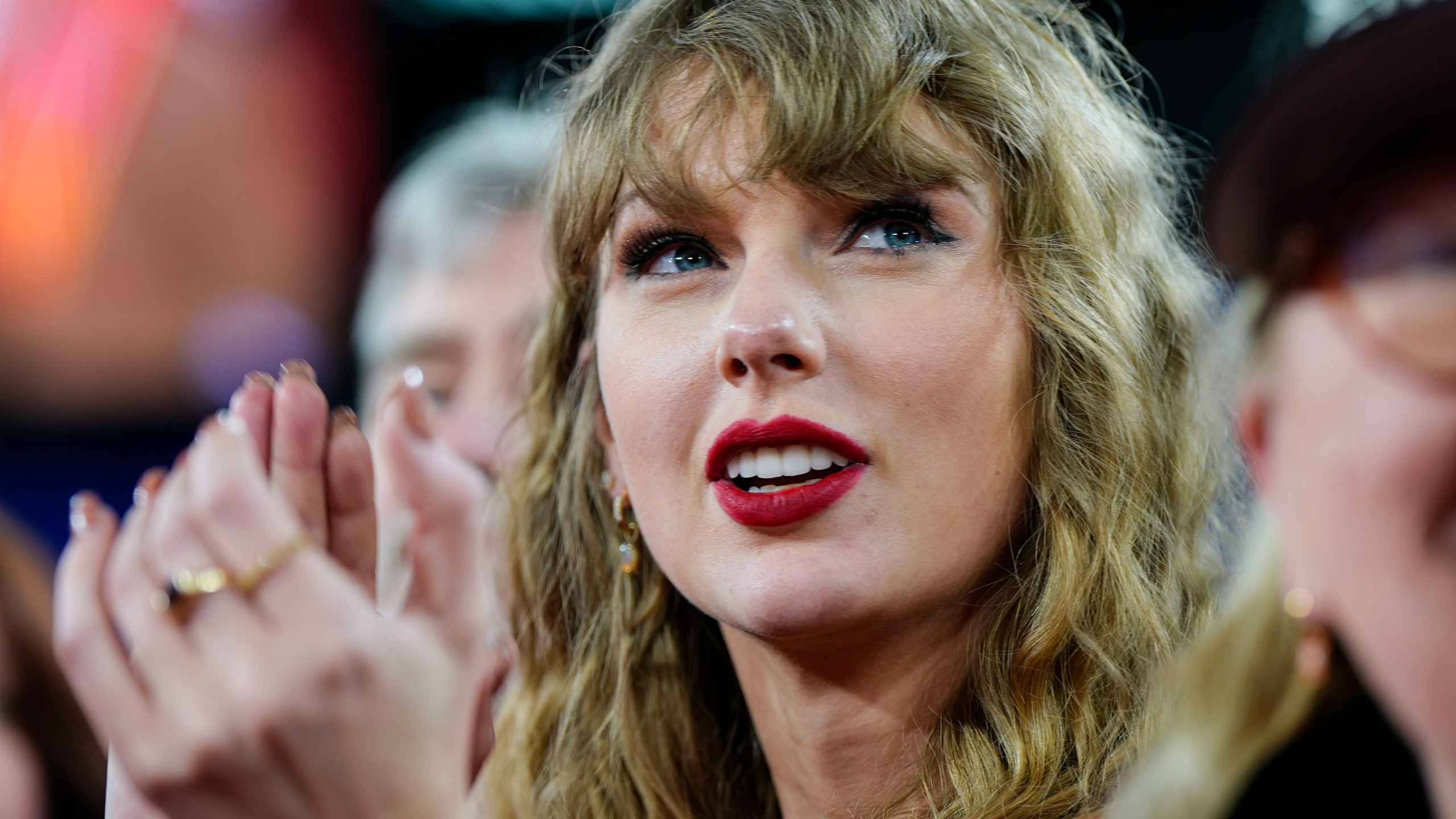 FILE - Taylor Swift stands on the field after an AFC Championship NFL football game between the Baltimore Ravens and the Kansas City Chiefs, Sunday, Jan. 28, 2024, in Baltimore. States were already sorting out how to address the growing issue of AI-generated deepfakes. Then Taylor Swift was victimized with her face appearing on pornographic images, and interest in addressing the problem grew. (AP Photo/Julio Cortez, File)