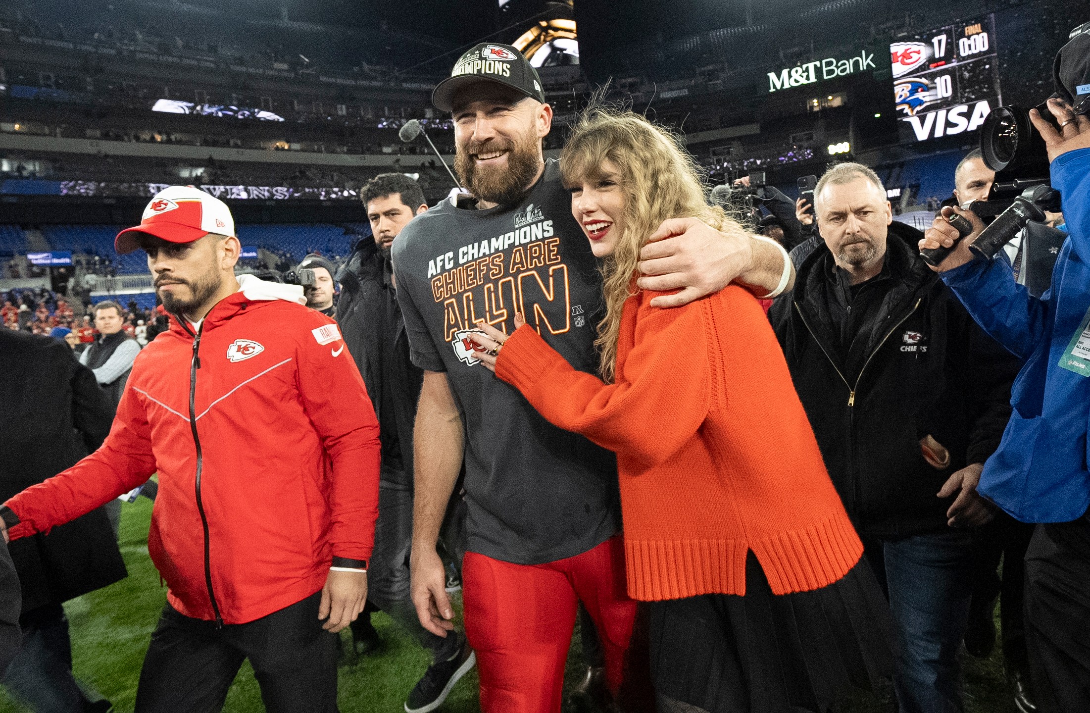 FILE - Kansas City Chiefs tight end Travis Kelce and Taylor Swift walk together after an AFC Championship NFL football game between the Chiefs and the Baltimore Ravens, Jan. 28, 2024, in Baltimore.. Taylor Swift, who is holding concerts in Japan, will make it in time for the Super Bowl to see her partner and football superstar Travis Kelce play. (AP Photo/Julio Cortez, File)