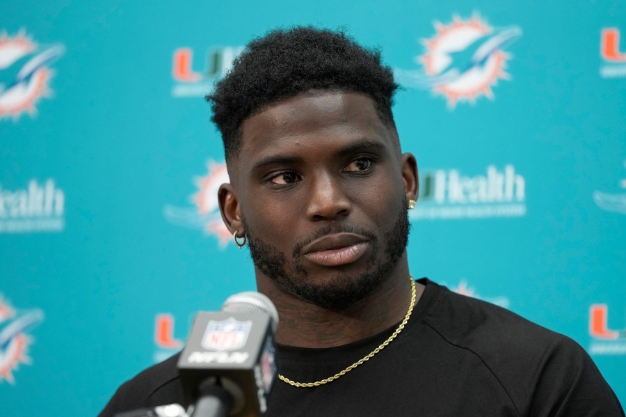 Miami Dolphins wide receiver Tyreek Hill speaks to reporters after an NFL football game.