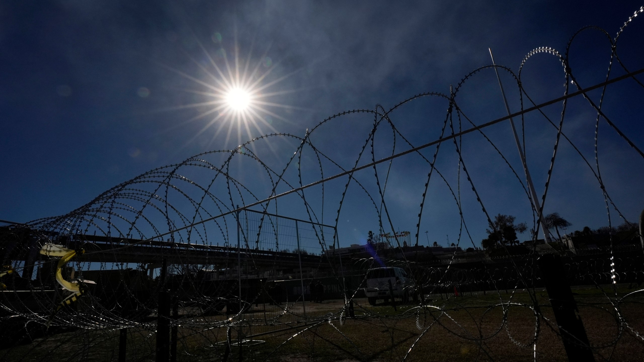 Concertina wire is stretched through Shelby Park where Texas Gov. Greg Abbott and fellow Governors held a news conference along the Rio Grande to discuss Operation Lone Star and border concerns, Sunday, Feb. 4, 2024, in Eagle Pass, Texas. Abbott returned to the Eagle Pass border to highlight his escalating attempts to curb illegal crossings on the U.S.-Mexico border. (AP Photo/Eric Gay)