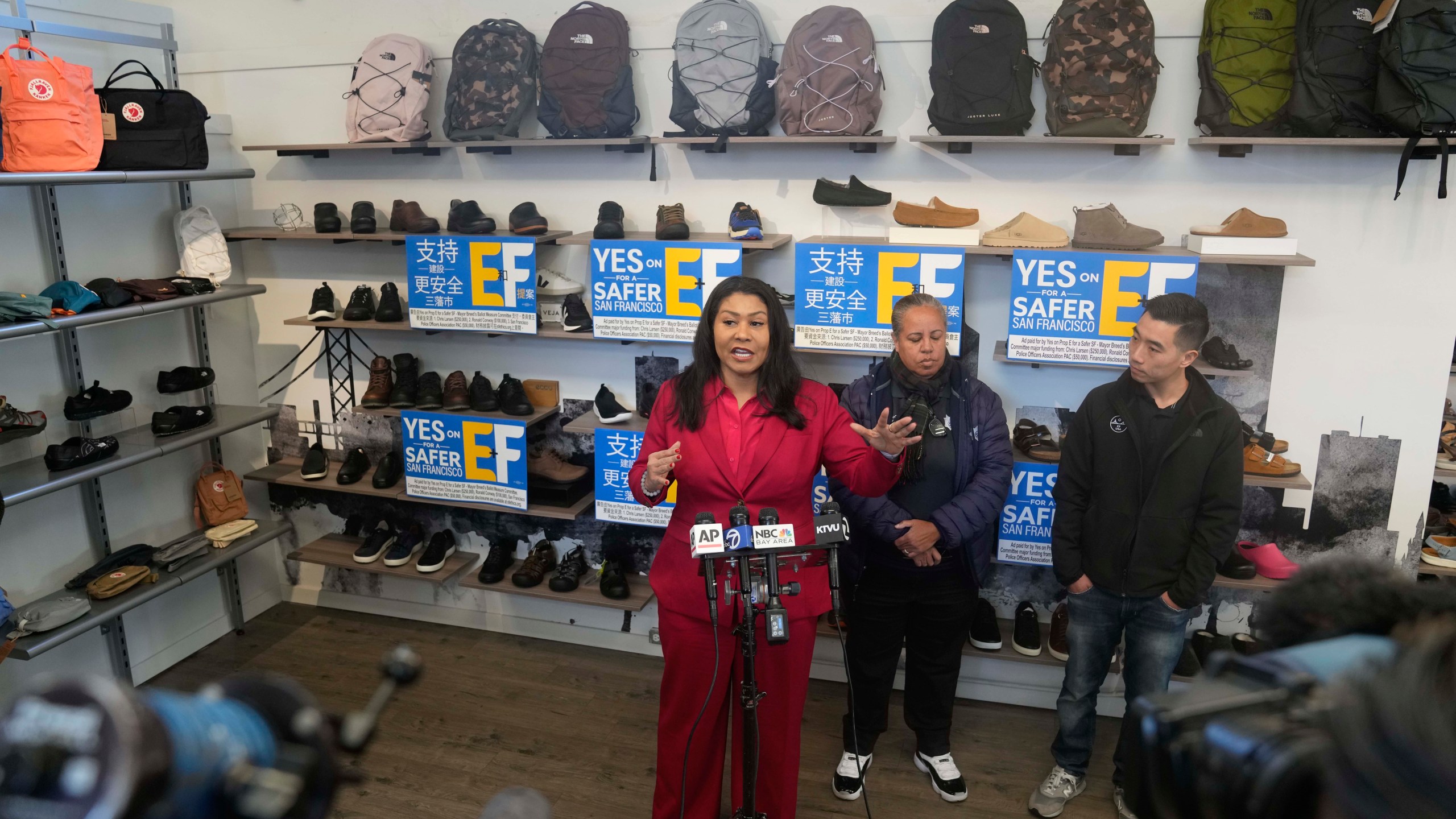 San Francisco Mayor London Breed speaks during a news conference to promote a crime measure at the Footprint retail store as store owner Mike Hsu, right, and police association President Tracy McCray listen, in San Francisco, Thursday, Jan. 25, 2024. The Democratic mayor of San Francisco is pushing a pair of controversial public safety proposals on the March 5, ballot. Critics say the measures are out of step with San Francisco's liberal politics and will hurt already marginalized communities. (AP Photo/Eric Risberg)