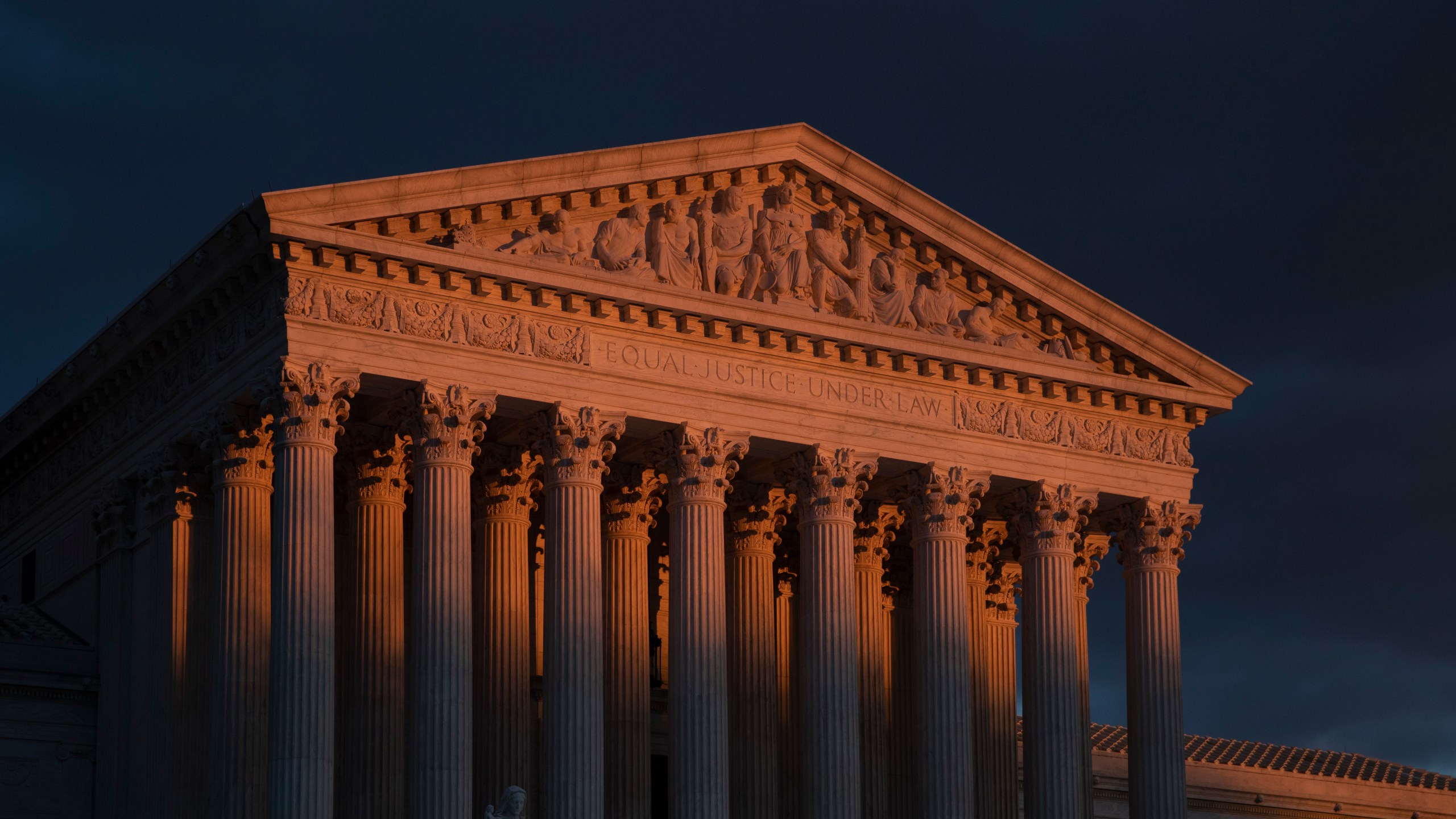 FILE - The Supreme Court is seen at sunset in Washington, on Jan. 24, 2019. The Supreme Court will be taking its first look in the 156-year history of the 14th Amendment at a provision, Section 3, that's meant to keep former officeholders who "engaged in insurrection" from ever regaining power. The stakes couldn't be higher in arguments taking place on Thursday, Feb. 8, 2024. (AP Photo/J. Scott Applewhite, File)