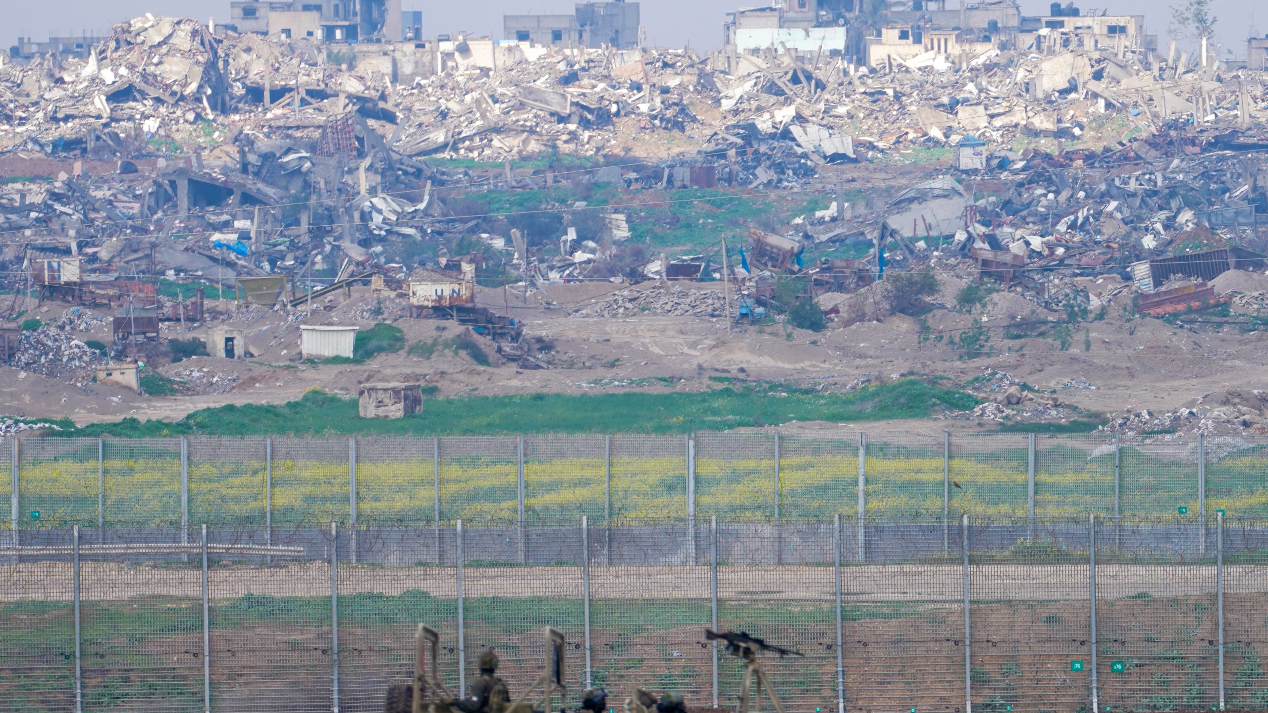 Israeli soldiers drive near the border with the Gaza Strip, as seen in southern Israel, Tuesday, Feb. 6, 2024. (AP Photo/Tsafrir Abayov)