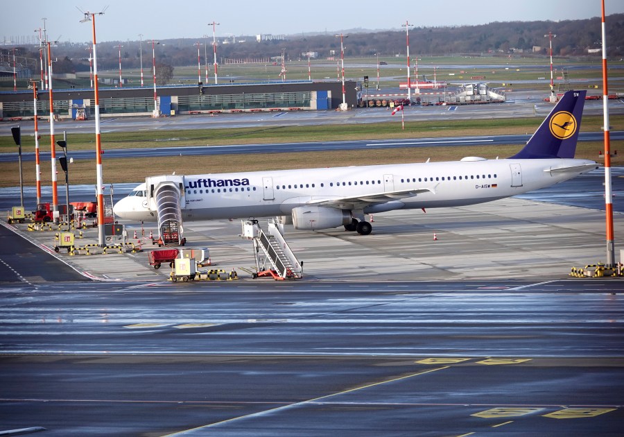 A Lufthansa aircraft stands on the apron at Hamburg Airport, Wednesday, Feb. 7, 2024. Ground staff for Lufthansa walked off the job at five major German airports on Wednesday, causing the airline to cancel hundreds of flights. The Ver.di union called on ground staff at Frankfurt and Munich, Lufthansa's two main hubs, as well as Berlin, Duesseldorf and Hamburg, to strike for 27 hours starting at 4 a.m. Wednesday.(Rabea Gruber/dpa via AP)