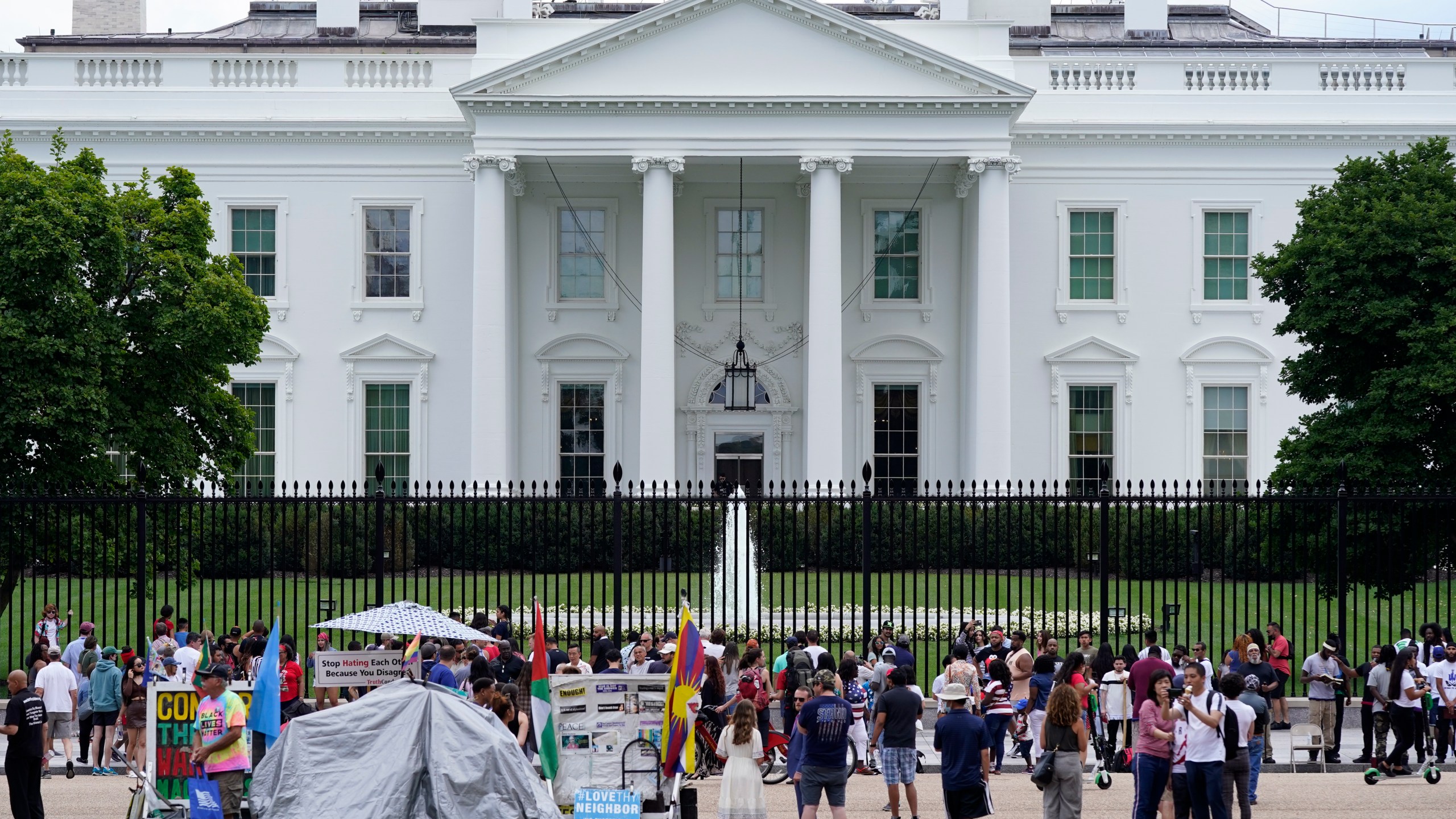 FILE - People gather on a section of Pennsylvania Avenue in front of the White House, July 4, 2021, in Washington. The Biden administration on Wednesday, Feb. 7, 2024, will name Elizabeth Kelly, a top White House aide, as the director of the newly established safety institute for artificial intelligence. (AP Photo/Patrick Semansky, File)