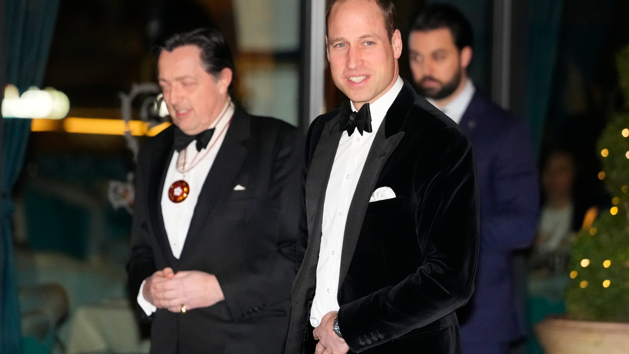 Britain's Prince William looks across to the media as he arrives to attend the London Air Ambulance Charity Gala in London, Wednesday, Feb. 7, 2024. (AP Photo/Kirsty Wigglesworth)