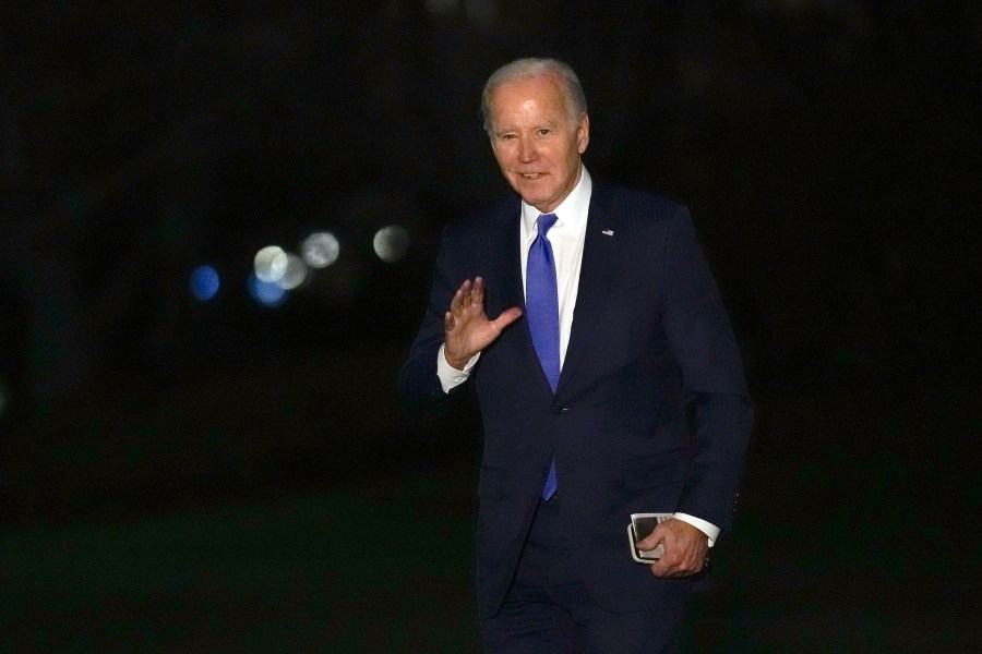 President Joe Biden waves as he walks across the South Lawn of the White House in Washington, Wednesday, Feb. 7, 2024, after returning from New York where he attended three fundraisers. (AP Photo/Susan Walsh)