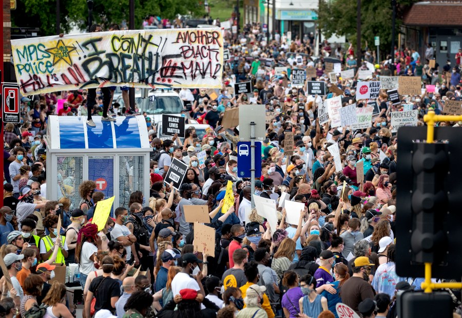 FILE - Protesters gather calling for justice for George Floyd, May 26, 2020, in Minneapolis. The city of Minneapolis agreed Thursday, Feb. 8, 2024, to pay $950,000 to settle a lawsuit alleging that journalists were subjected to police harassment and even hurt while covering protests over the police killings of Floyd. (Carlos Gonzalez/Star Tribune via AP, File)