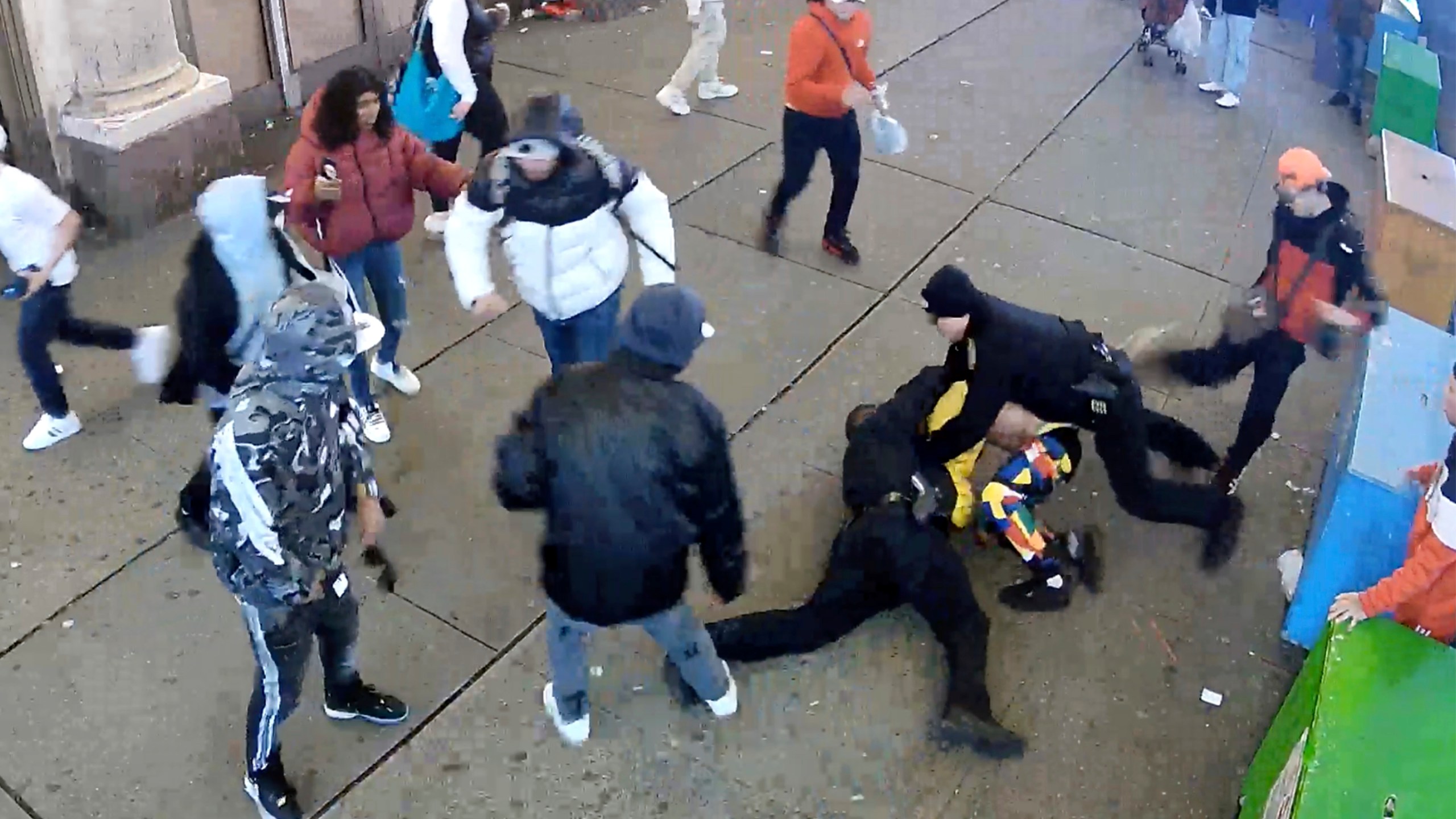 This image from video provided by the Office of the Manhattan District Attorney, Thursday, Feb. 8, 2024, shows the brawl between New York City Police Department officers and migrants in Times Square, Jan. 27, 2024. Manhattan D.A. Alvin Bragg announced six additional indictments of men allegedly involved in a brawl with police officers in Times Square, but he said investigators were still working to identify several suspects and their exact role in the frenzy. (Manhattan District Attorney via AP)