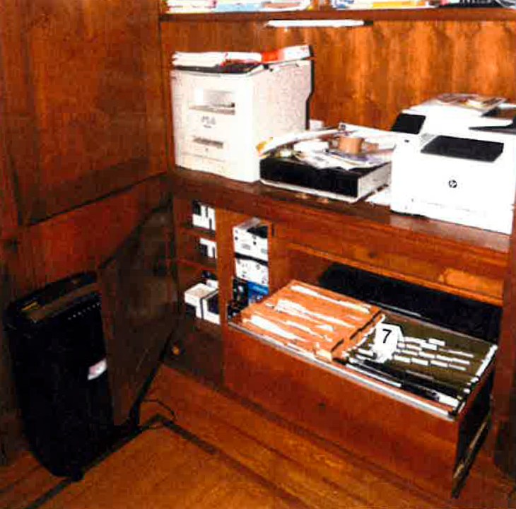 This image, contained in the report from special counsel Robert Hur, shows notebooks in a file cabinet under a printer that were seized in first-floor home office of President Joe Biden in Wilmington, Del., on Jan. 20, 2023, during a search by FBI agents. (Justice Department via AP)