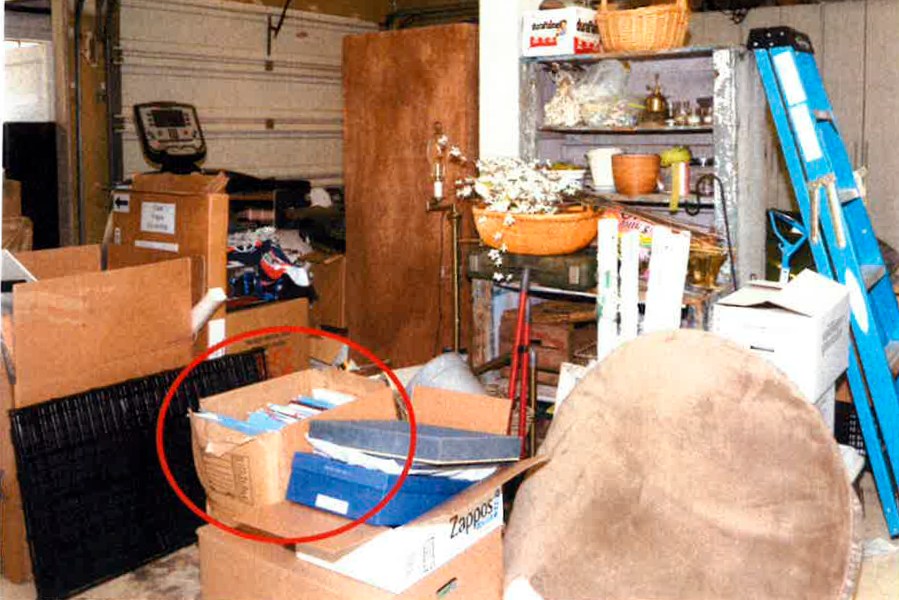 This image, contained in the report from special counsel Robert Hur, shows the box where classified Afghanistan documents were found in the garage of President Joe Biden in Wilmington, Del., during a search by the FBI on Dec. 21, 2022. (Justice Department via AP)