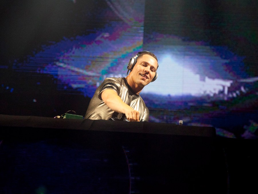 FILE - DJ Tiesto performs during a concert at the Presidente Festival at the Olympic Stadium in Santo Domingo, Dominican Republic on Oct. 3, 2014. Dutch music producer DJ Tiësto has withdrawn from performing at Sunday's Super Bowl due to an undisclosed family matter. The Dutchman wrote on social media that “it was a tough decision to miss the game, but family always comes first.” (AP Photo/Tatiana Fernandez, File)