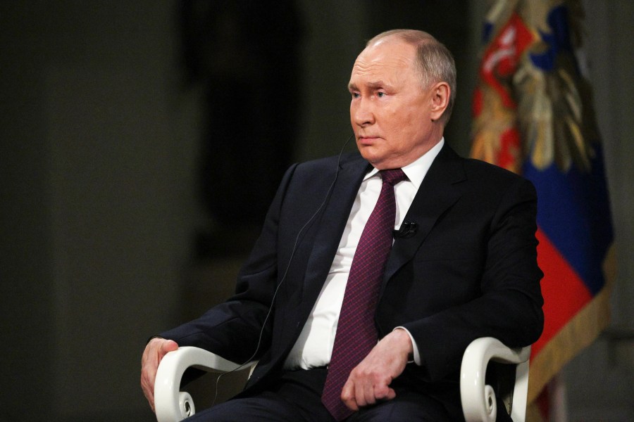 In this photo released by Sputnik news agency on Friday, Feb. 9, 2024, Russian President Vladimir Putin attends an interview with former Fox News host Tucker Carlson at the Kremlin in Moscow, Russia, Tuesday, Feb. 6, 2024. (Gavriil Grigorov, Sputnik, Kremlin Pool Photo via AP)