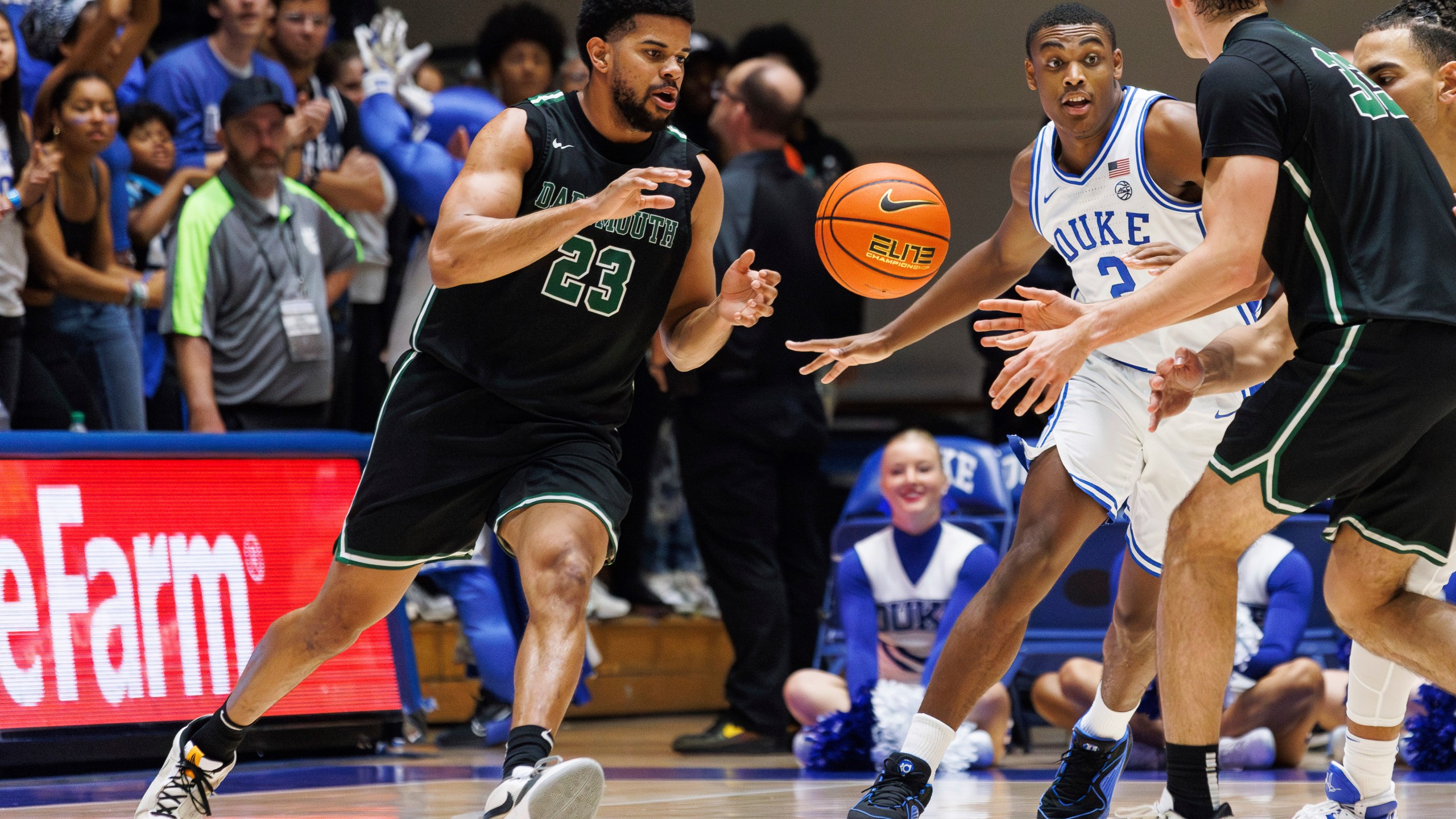 FILE - Dartmouth's Robert McRae III (23) takes a pass from Jackson Munro (33) as Duke's Jaylen Blakes (2) defends during the second half of an NCAA college basketball game in Durham, N.C., Nov. 6, 2023. A National Labor Relations Board regional official has decided that Dartmouth basketball players are employees of the school, clearing the way for an election that would create the first-ever labor union for NCAA athletes. (AP Photo/Ben McKeown, File)