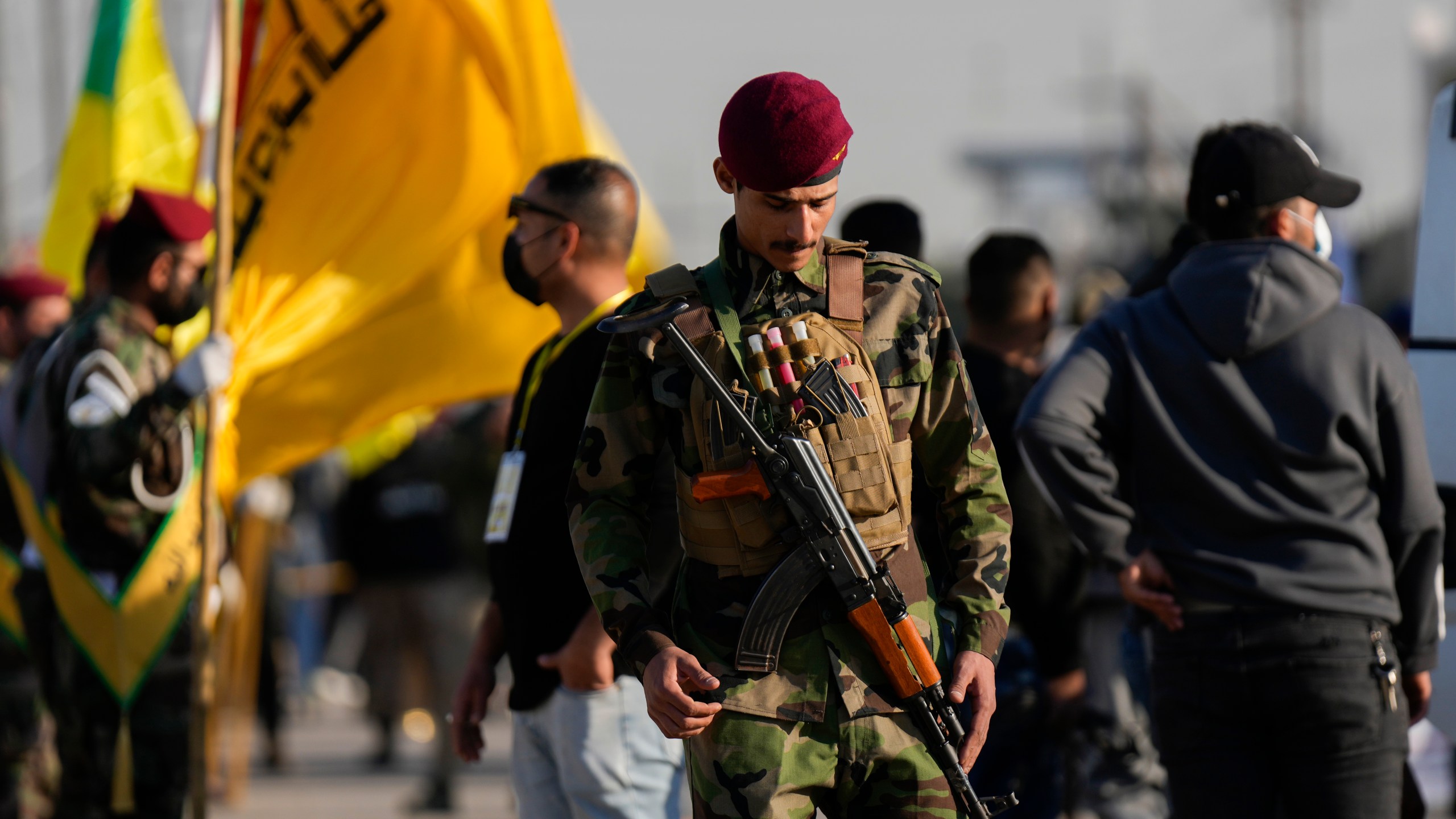 Fighters from the Popular Mobilization Forces, attends the funeral of a commander from the Kataib Hezbollah paramilitary group, Wissam Muhammad Sabir Al-Saadi, known as Abu Baqir Al-Saadi, who was killed in a U.S. airstrike, in Baghdad, Iraq, Thursday, Feb. 8, 2024. The U.S. military says a U.S. drone strike blew up a car in the Iraqi capital Wednesday night, killing the high-ranking commander. (AP Photo/Hadi Mizban)