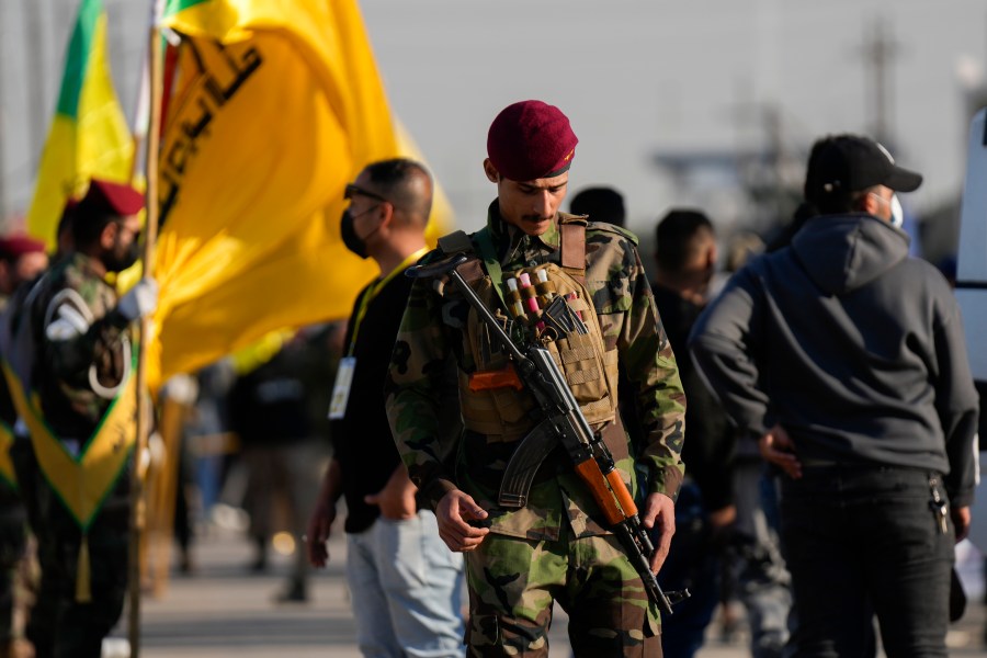 Fighters from the Popular Mobilization Forces, attends the funeral of a commander from the Kataib Hezbollah paramilitary group, Wissam Muhammad Sabir Al-Saadi, known as Abu Baqir Al-Saadi, who was killed in a U.S. airstrike, in Baghdad, Iraq, Thursday, Feb. 8, 2024. The U.S. military says a U.S. drone strike blew up a car in the Iraqi capital Wednesday night, killing the high-ranking commander. (AP Photo/Hadi Mizban)