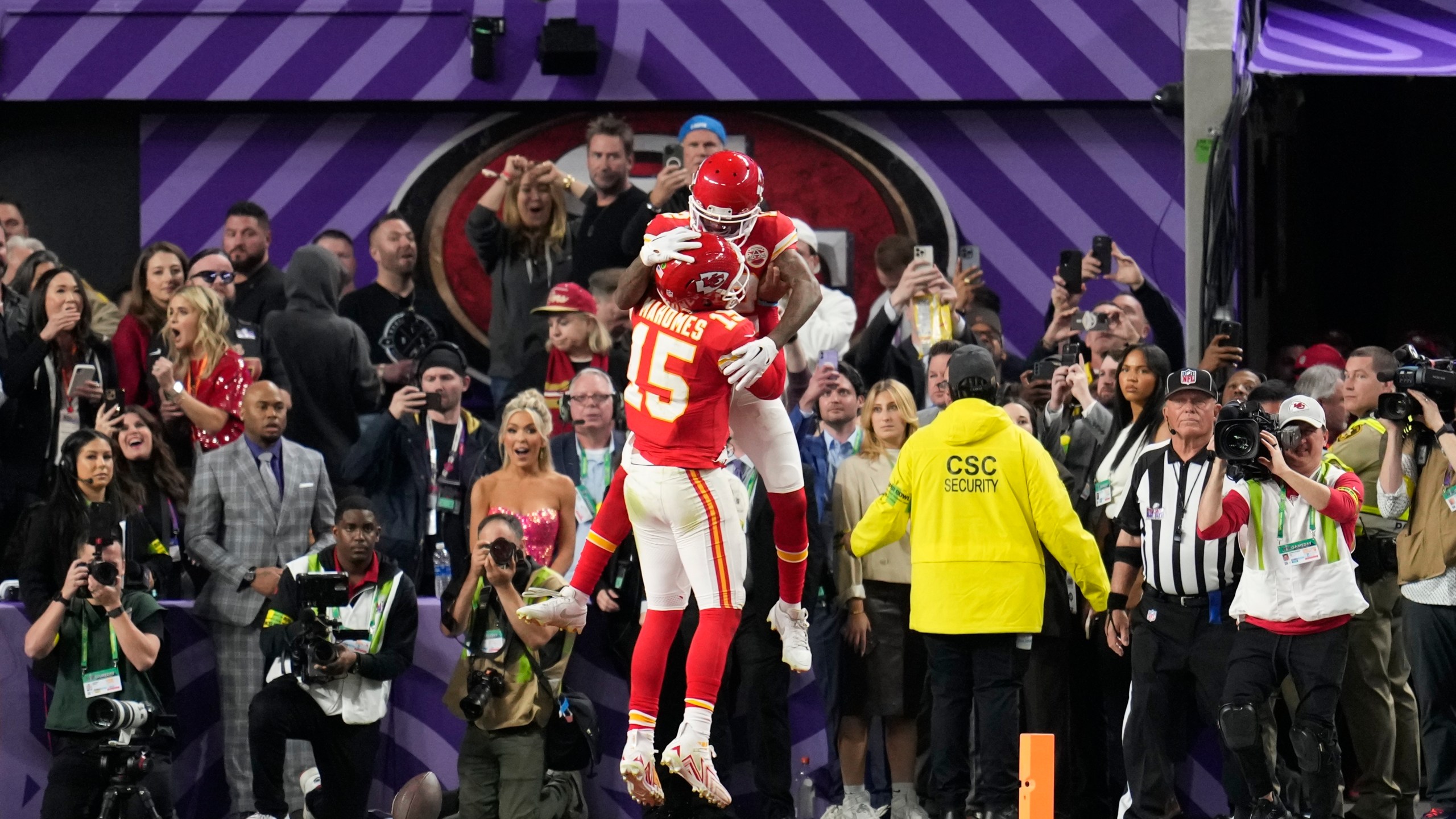 Kansas City Chiefs wide receiver Mecole Hardman Jr. (12) celebrates his game-winning touchdown with quarterback Patrick Mahomes (15) in overtime during the NFL Super Bowl 58 football game against the San Francisco 49ers, Sunday, Feb. 11, 2024, in Las Vegas. The Chiefs won 25-22. (AP Photo/Abbie Parr)