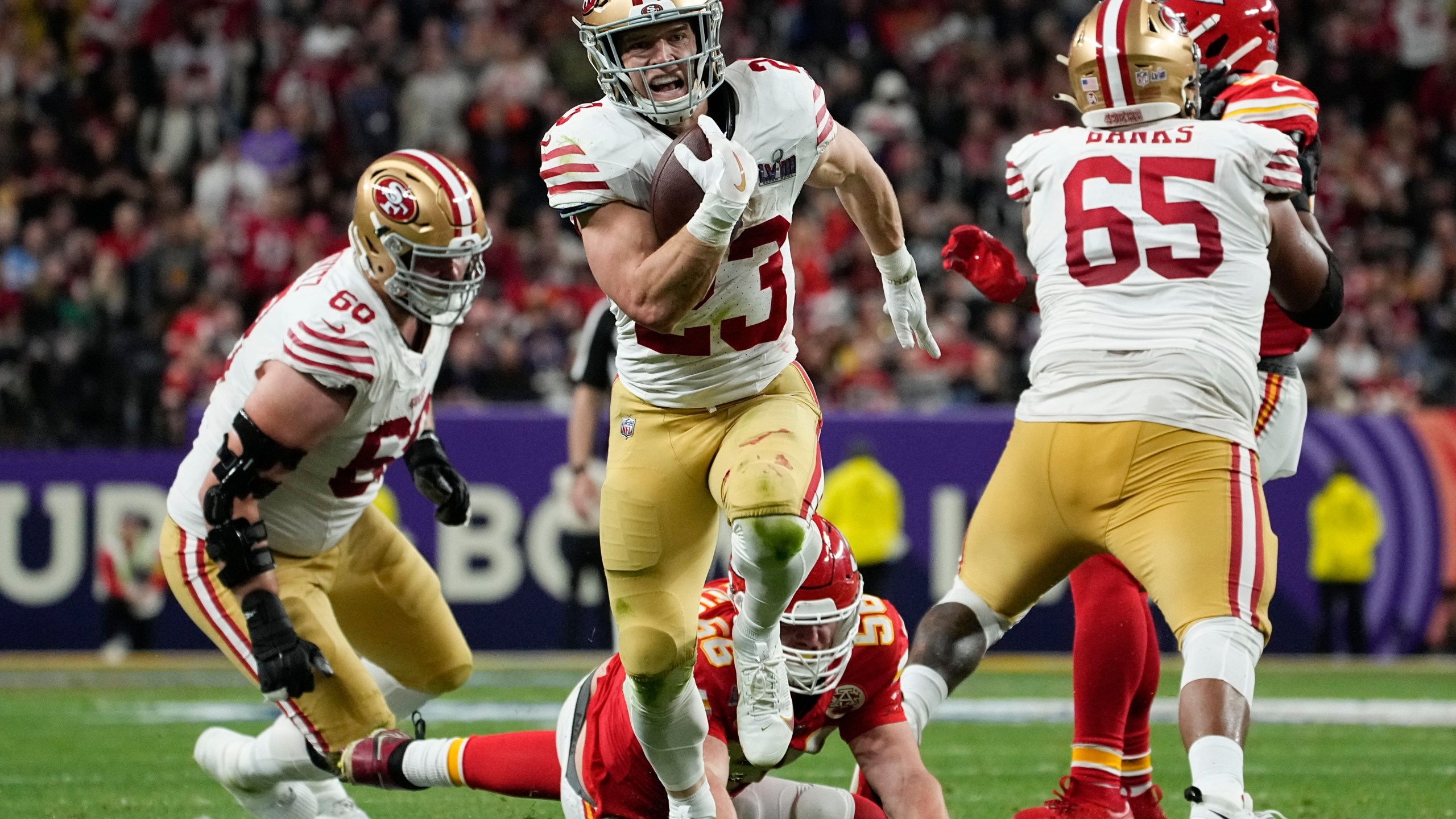 San Francisco 49ers running back Christian McCaffrey (23) runs into the end zone for a topuchdown against the Kansas City Chiefs during the first half of the NFL Super Bowl 58 football game Sunday, Feb. 11, 2024, in Las Vegas. (AP Photo/George Walker IV)