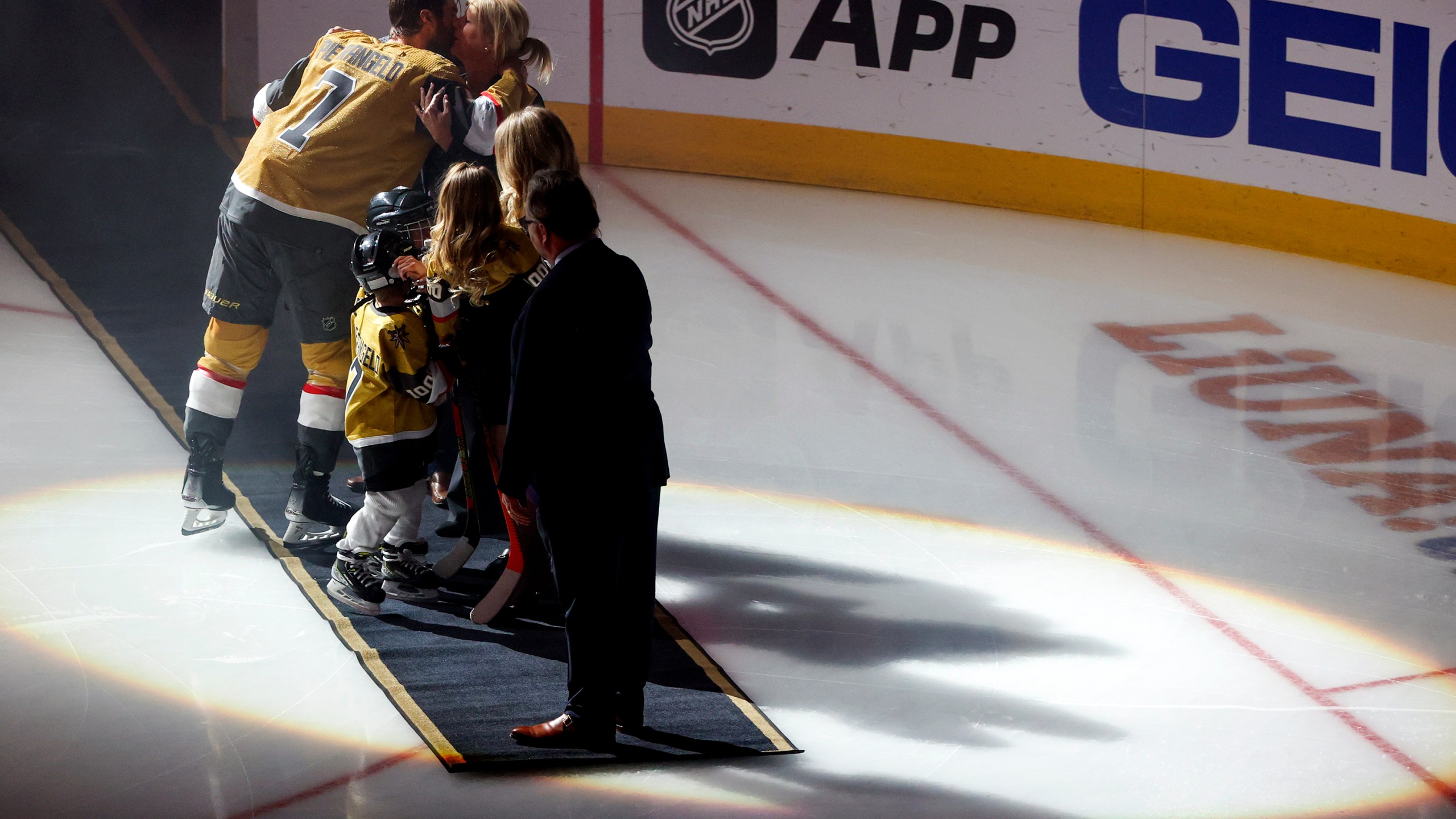 Vegas Golden Knights defenseman Alex Pietrangelo (7) kisses his wife, Jayne, during a ceremony honoring his 1000th NHL game prior to an NHL hockey game against the Minnesota Wild, Monday, Feb. 12, 2024, in Las Vegas. (AP Photo/Ian Maule)