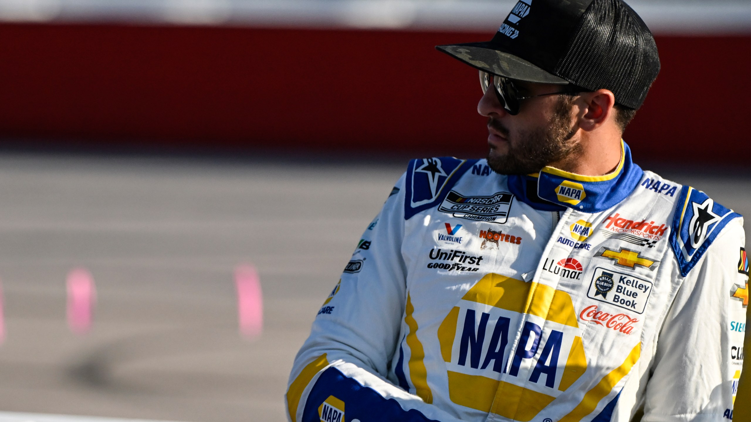 FILE - Chase Elliott looks on prior to a NASCAR Cup Series auto race at Darlington Raceway, Sunday, Sept. 3, 2023, in Darlington, S.C. Chase Elliott wants to race cars. Fast cars that he can drive to a second NASCAR championship. The rest of the stuff? The crowds, the commercials, the showcasing his every move on social media? That’s just never going to be part of the job that Elliott finds enjoyable. (AP Photo/Matt Kelley)