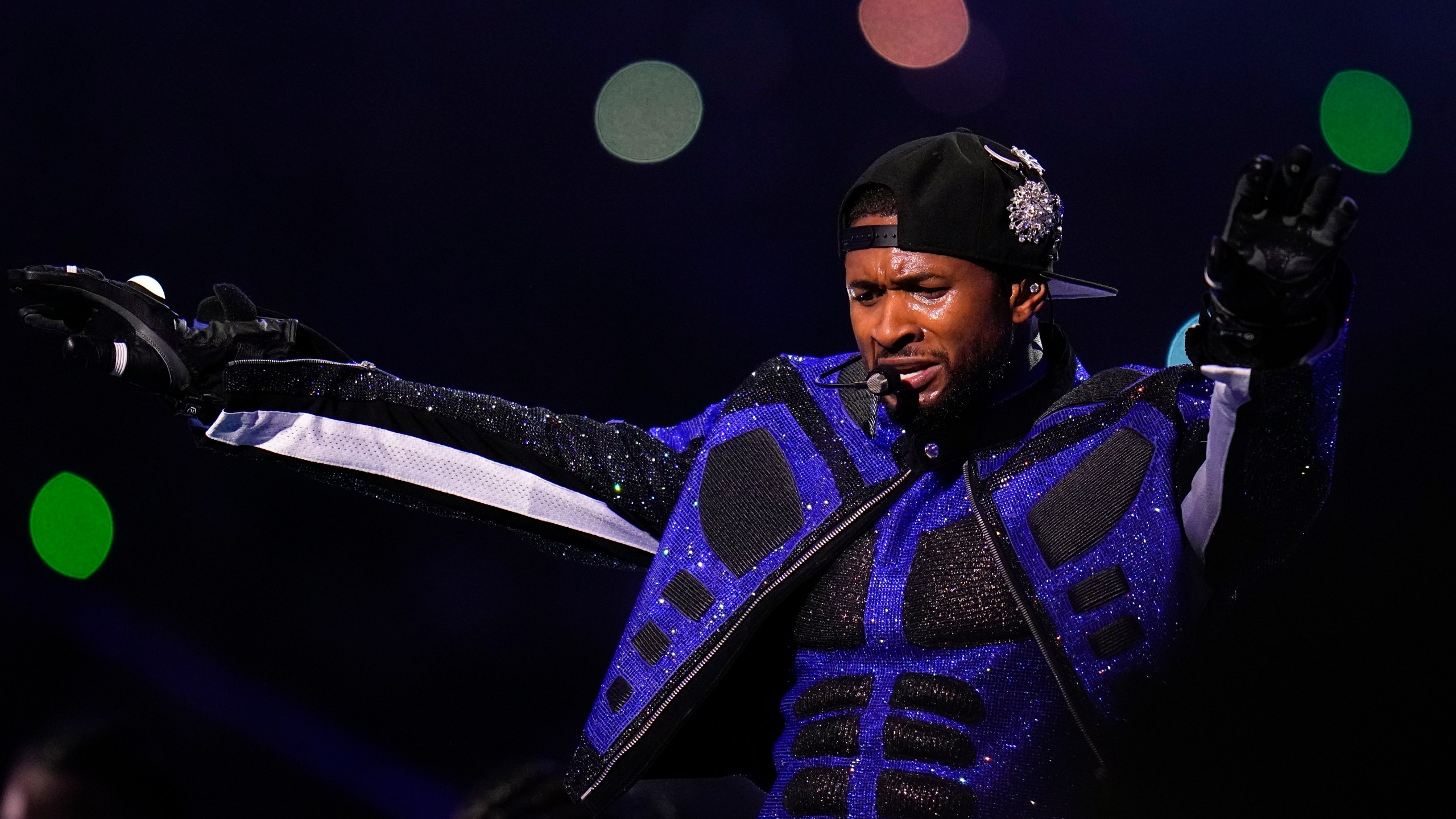 Usher performs during halftime of the NFL Super Bowl 58 football game between the San Francisco 49ers and the Kansas City Chiefs Sunday, Feb. 11, 2024, in Las Vegas. (AP Photo/Julio Cortez)