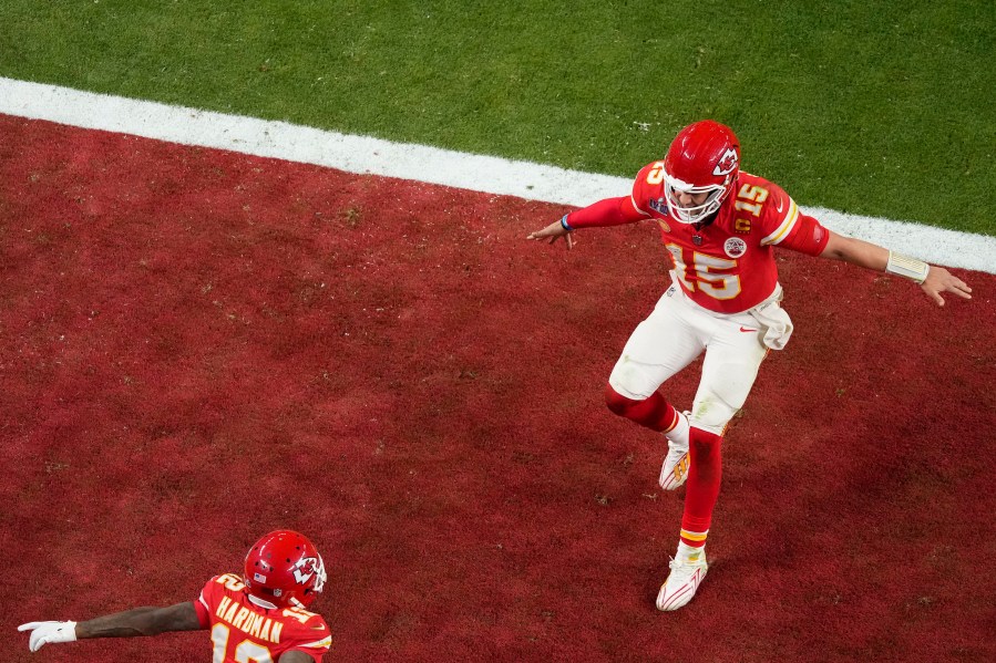 Kansas City Chiefs quarterback Patrick Mahomes, right, celebrates with wide receiver Mecole Hardman Jr. after throwing the game-winning touchdown against the San Francisco 49ers during overtime of the NFL Super Bowl 58 football game Sunday, Feb. 11, 2024, in Las Vegas. (AP Photo/David J. Phillip)