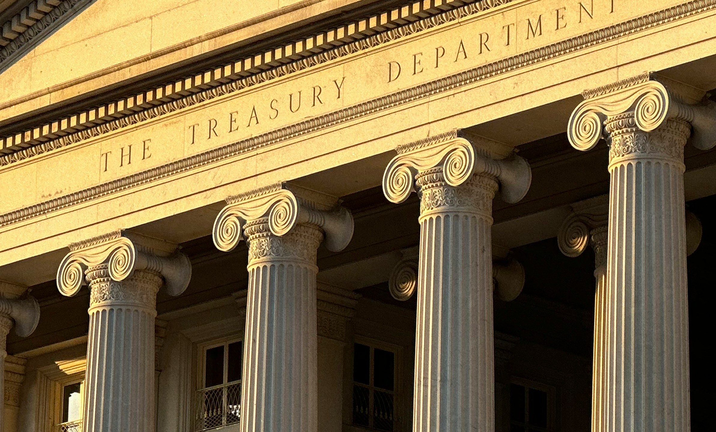 FILE - The Treasury Department is seen near sunset in Washington, Jan. 18, 2023. The U.S. on Feb. 14, 2024, imposed sanctions on three people and four firms, across Iran, the United Arab Emirates and Turkey, for allegedly helping to export goods and technology purchased from U.S. companies to Iran and the nation's central bank. Treasury's Office of Foreign Assets Control said the procurement network transferred U.S. technology for use by Iran's Central Bank in violation of U.S. export restrictions and sanctions. (AP Photo/Jon Elswick, File)