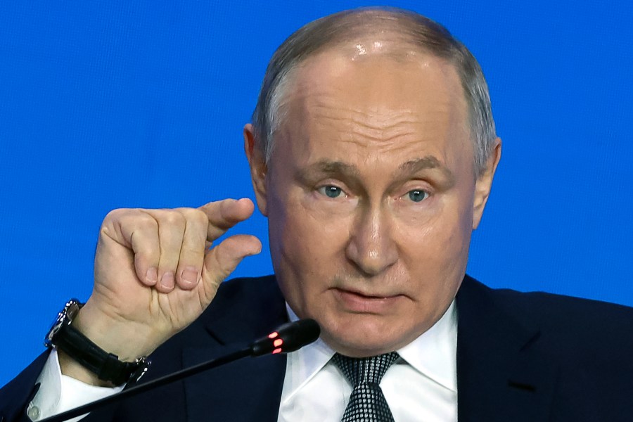 Russian President Vladimir Putin gestures as he speaks to scientists on the sidelines of the Future Technologies Forum at the World Trade Centre in Moscow, Russia, Wednesday, Feb. 14, 2024. (Sergei Karpukhin, Sputnik, Kremlin Pool Photo via AP)