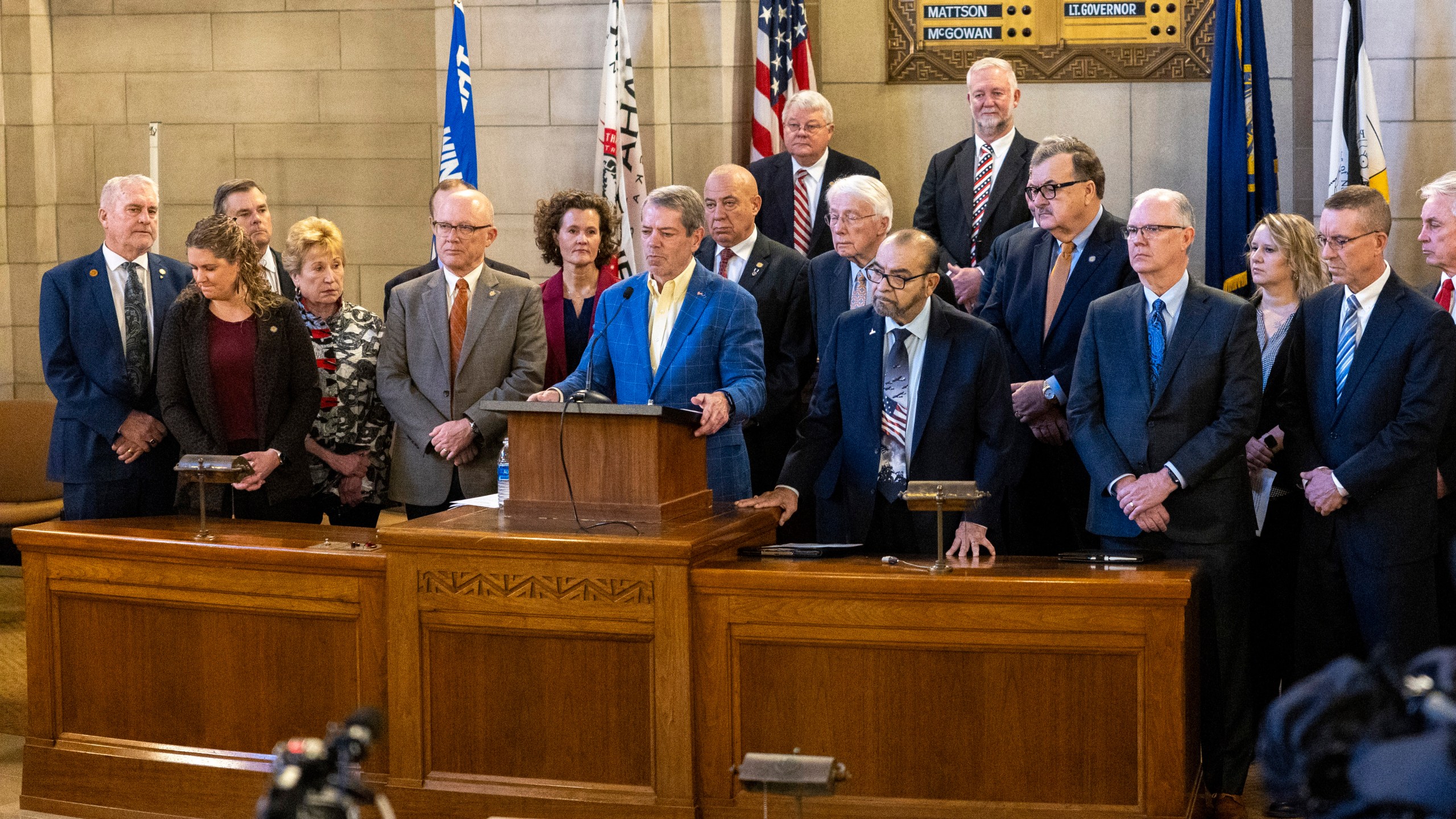 Gov. Jim Pillen is joined by republican state senators as he announces that the state will participate in the Summer Electronic Benefits Transfer Program after previously saying Nebraska wouldn't take part during a press conference in the Warner Chamber at the Capitol, Monday, Feb. 12, 2024, in Lincoln, Neb. (Kenneth Ferriera/Lincoln Journal Star via AP)