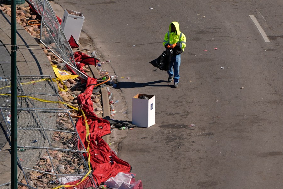 A worker cleans outside of Union Station Thursday, Feb. 15, 2024, in Kansas City, Mo. The venue was the site of a mass shooting Wednesday after a rally celebrating the Kansas City Chiefs winning the NFL Super Bowl 58 football game. (AP Photo/Charlie Riedel)