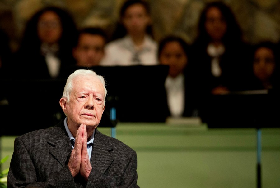 FILE - Former President Jimmy Carter teaches Sunday School class at Maranatha Baptist Church in his hometown, Aug. 23, 2015, in Plains, Ga. In the year since Jimmy Carter first entered home hospice care, the 39th president has celebrated his 99th birthday, enjoyed tributes to his legacy and outlived his wife of 77 years. Rosalynn Carter, who died in November 2023 after suffering from dementia, spent just a few days under hospice. (AP Photo/David Goldman, File)