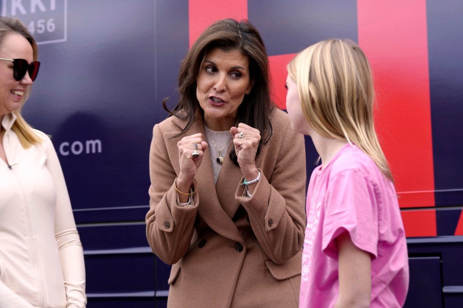 Republican presidential candidate former UN Ambassador Nikki Haley, center, talks with a young supporter after speaking at a campaign event on Feb. 19, 2024, in Camden, S.C. Haley has sharpened her attacks on former President Donald Trump, the GOP front-runner, as the two prepare to face off in South Carolina's Republican primary on Feb. 24. (AP Photo/Meg Kinnard)