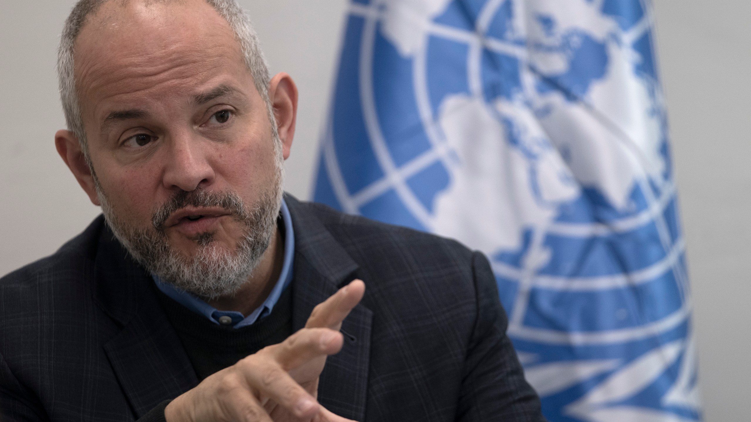 Dr. Adam Bouloukos the Director of United Nations Relief and Works Agency for Palestinian Refugees in the Near East (UNRWA) Affairs in the West Bank, speaks to journalists UNWRA at Aida Refugee Camp in the West Bank city of Bethlehem, Tuesday, Feb. 20, 2024. (AP Photo/Maya Alleruzzo)