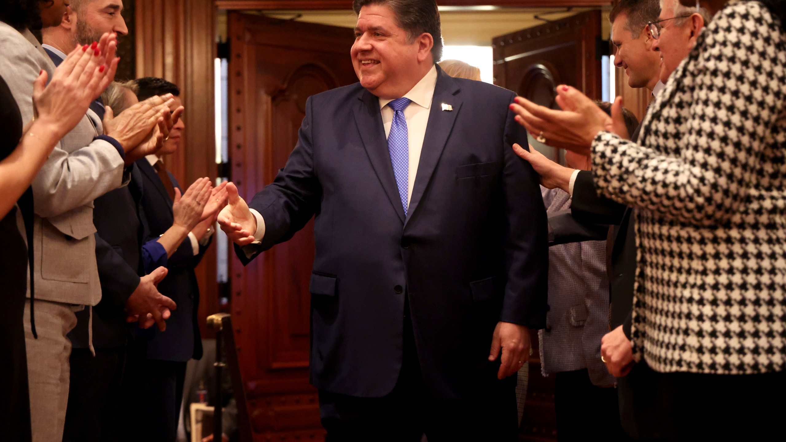 Illinois Gov. J.B. Pritzker arrives to deliver his State of the State and budget address before the General Assembly at the Illinois State Capitol, Wednesday, Feb. 21, 2024, in Springfield, Ill. (Brian Cassella/Chicago Tribune via AP, Pool)