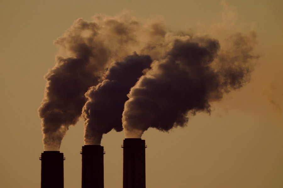 FILE - Emissions rise from the smokestacks at the Jeffrey Energy Center coal power plant as the suns sets, near Emmett, Kan., Sept. 18, 2021. The Supreme Court's conservative majority seemed skeptical Wednesday, Feb. 21, 2024, as a government lawyer argued that the Environmental Protection Agency should be allowed to continue enforcing its anti-air-pollution "good neighbor'' rule. (AP Photo/Charlie Riedel, File)