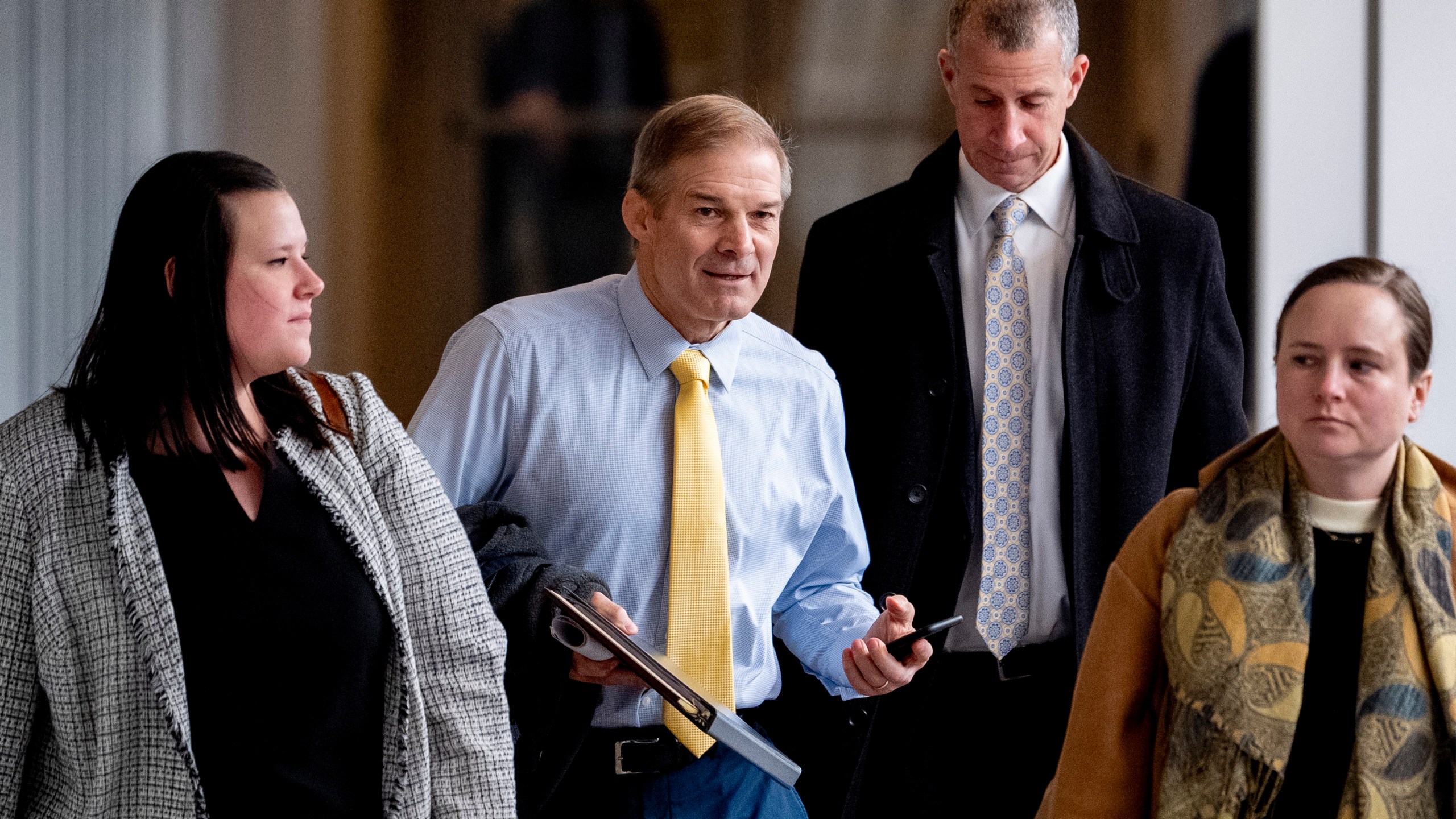 Rep. Jim Jordan, R-Ohio, center, and Republican staff attorney Steve Castor, second from right, arrive for a private interview with James Biden, the brother of President Joe Biden, at Thomas P. O'Neill House Office Building on Capitol Hill in Washington, Wednesday, Feb. 21, 2024. (AP Photo/Andrew Harnik)